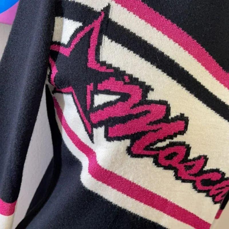 Moschino varsity sweater star black pink ivory

Celebrate the season wearing this varsity style sweater by Moschino! Pair with white or black skinny jeans and boots for a finished look.

Size 8
Across chest - 17 1/2 in.
Across waist - 15 1/2