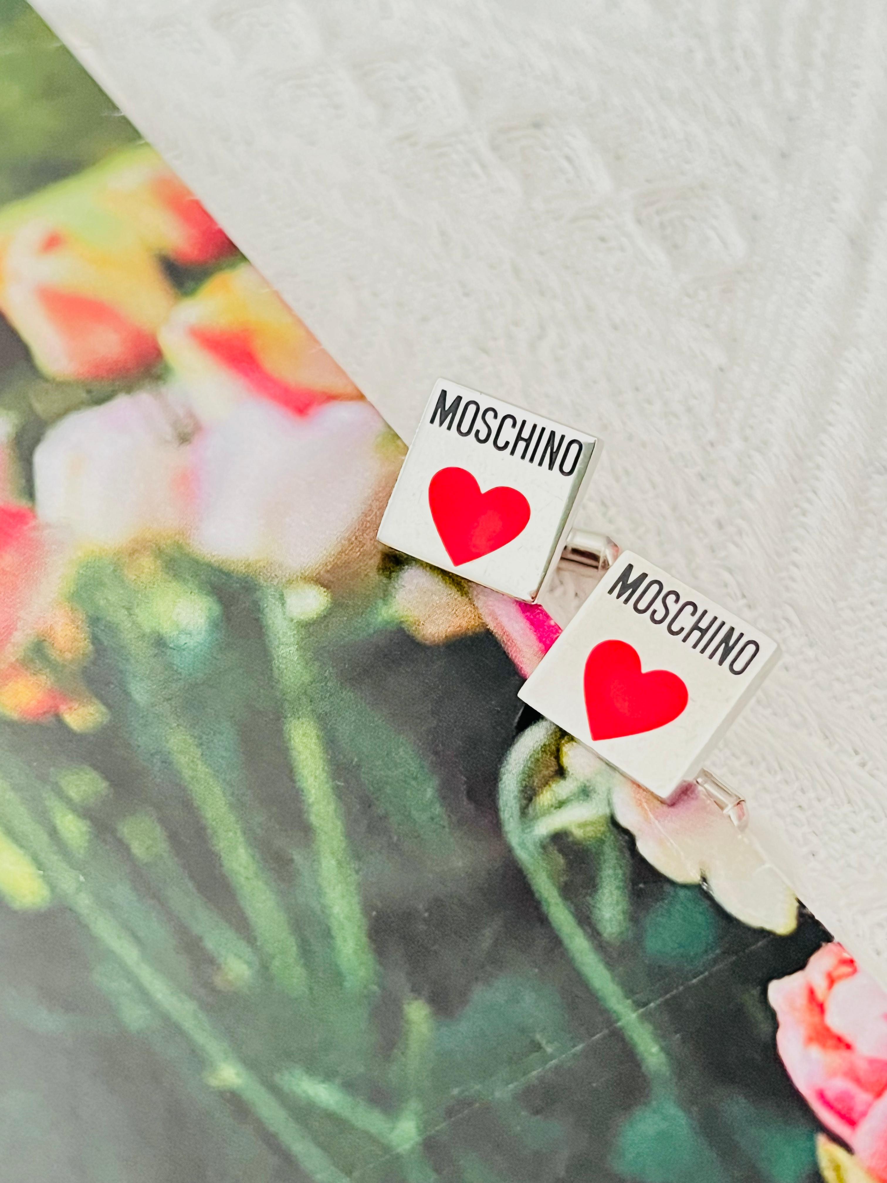 Moschino Vintage Classic Black Hallmark Logo Monogram Red Heart Love Square Cufflinks, Silver Tone

Very good condition. Maybe light scratches or colour loss. 100% Genuine.

Rare to find. Signed at back.

Size: 1.3*1.3 cm.

Weight: 6 g/each.

_ _
