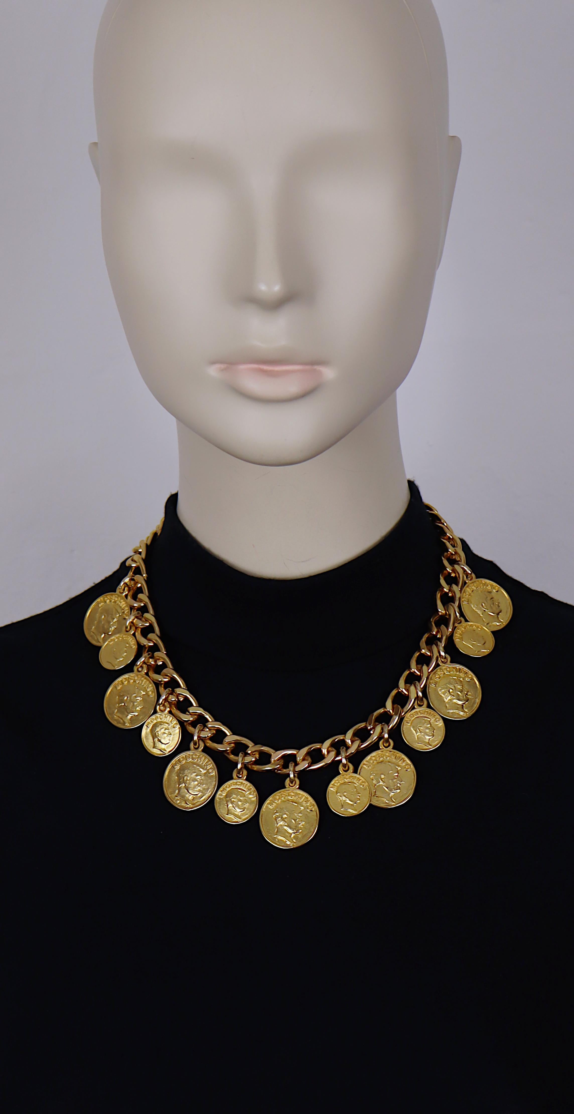 MOSCHINO vintage gold tone chain necklace featuring FRANCO MOSCHINO coin charms.

Spring clasp closure.

Embossed MOSCHINO.

Indicative measurement : length approx. 45.5 cm (17.91 inches) / chain width approx. 1 cm (0.39 inch) / largest coin