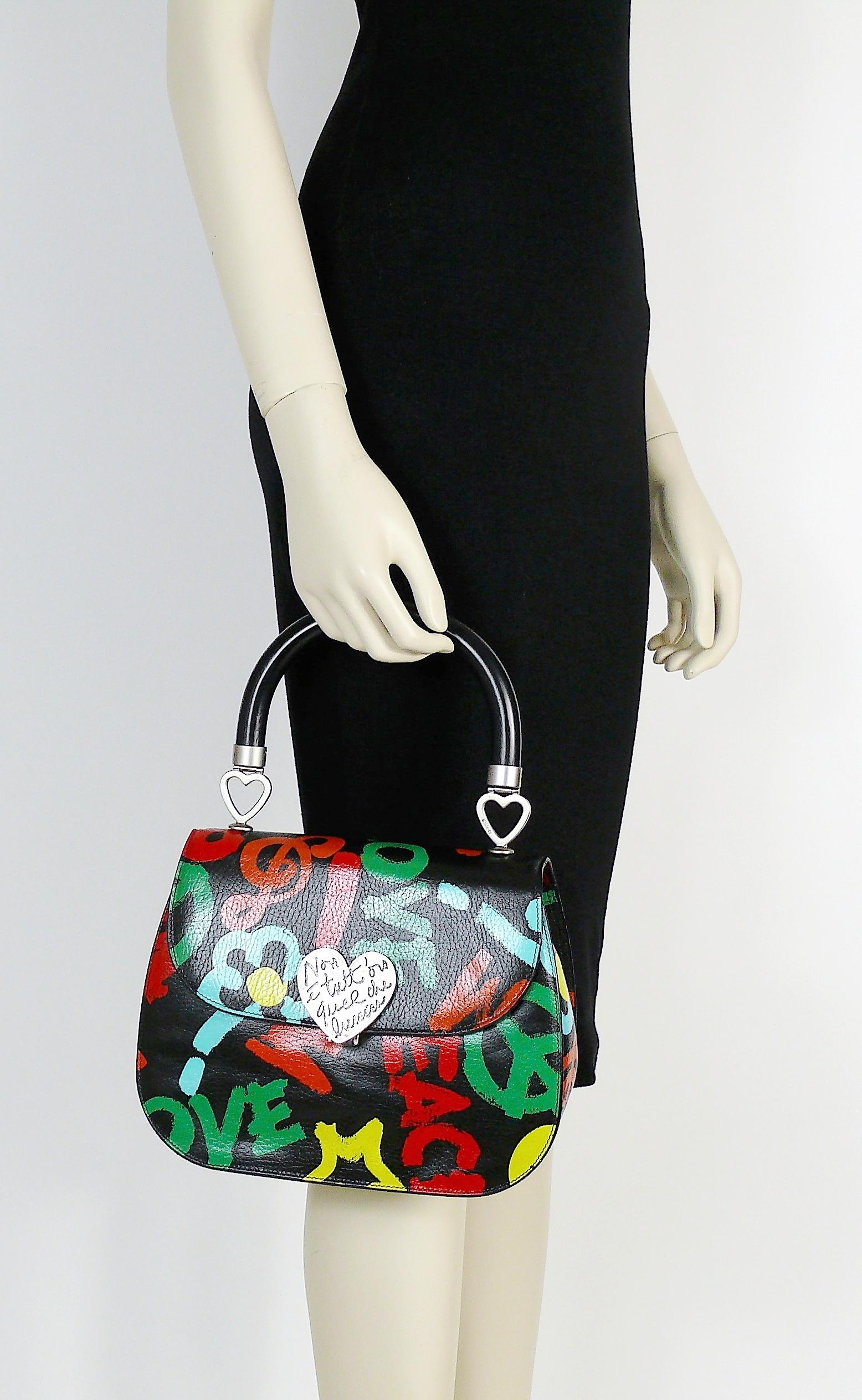 MOSCHINO vintage rare black leather handbag featuring multicolor graffitis all over (peace, love, smiley face, flowers, treble key) and an antiqued silver toned heart clasp embossed with the italian quote : Non E Tutt'Oro Quello Che Luccia (All That