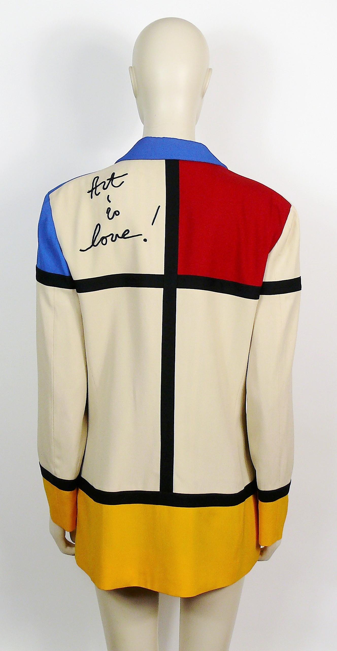 MOSCHINO vintage rare and iconic ART IS LOVE ! blazer. Tribute to the Dutch born artist PIET MONDRIAN.

This blazer features :
- PIET MONDRIAN inspired minimalist De Stijl Modern Art in red, blue and yellow color block design.
- Large heart on right