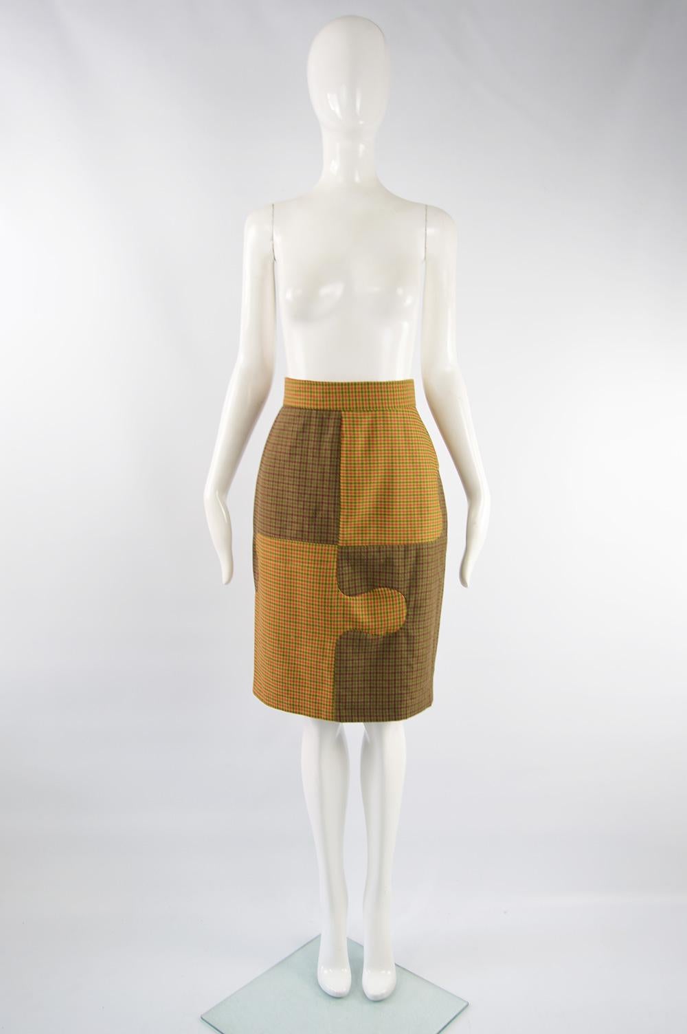 A fabulous vintage women's Moschino skirt from the late 80s. Made in Italy, in two contrasting plaid check wool fabrics with Moschino's iconic Cheap & Chic heart logo on the button. Perfect for spring / autumn or for wearing in the office. 
Size: