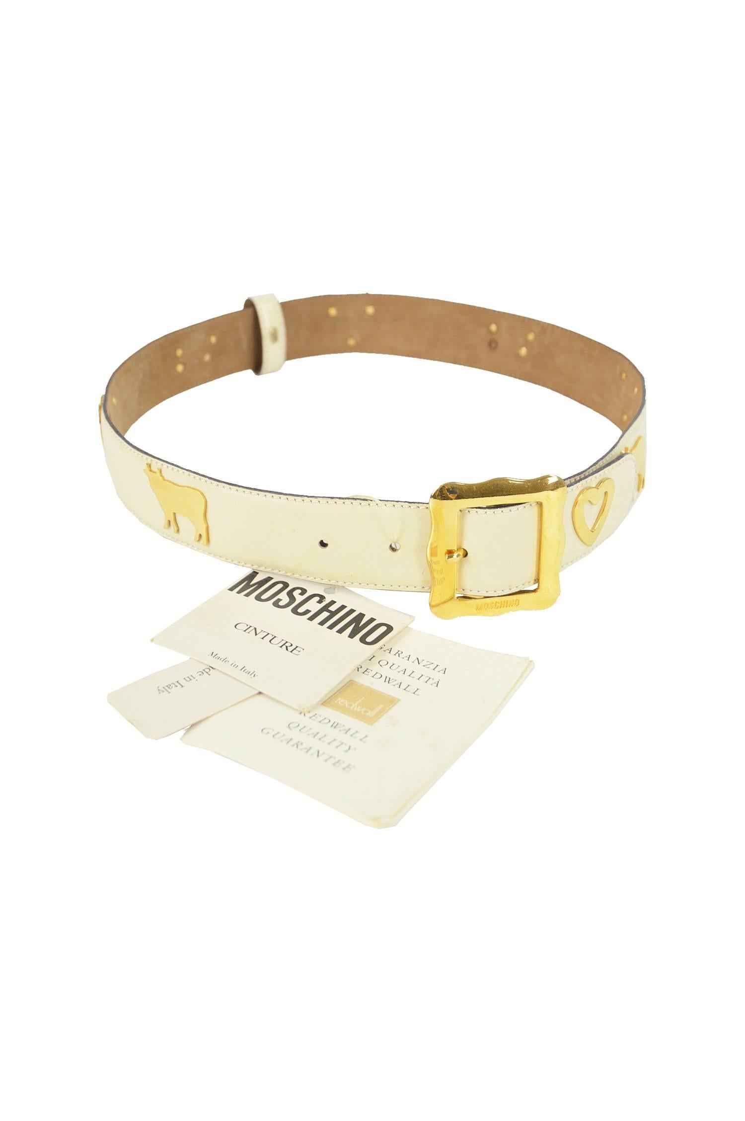 Moschino Vintage White & Gold Leather Belt with Cows & Hearts, 1980s NWT

Estimated Size: UK 8-10/ US 4-6/ EU 36-38. Please check measurements. 
Width (Smallest notch) - 26” / 66cm
Width (Largest notch) - 28” / 71cm
Length - 1.4” / 3.5cm

Condition: