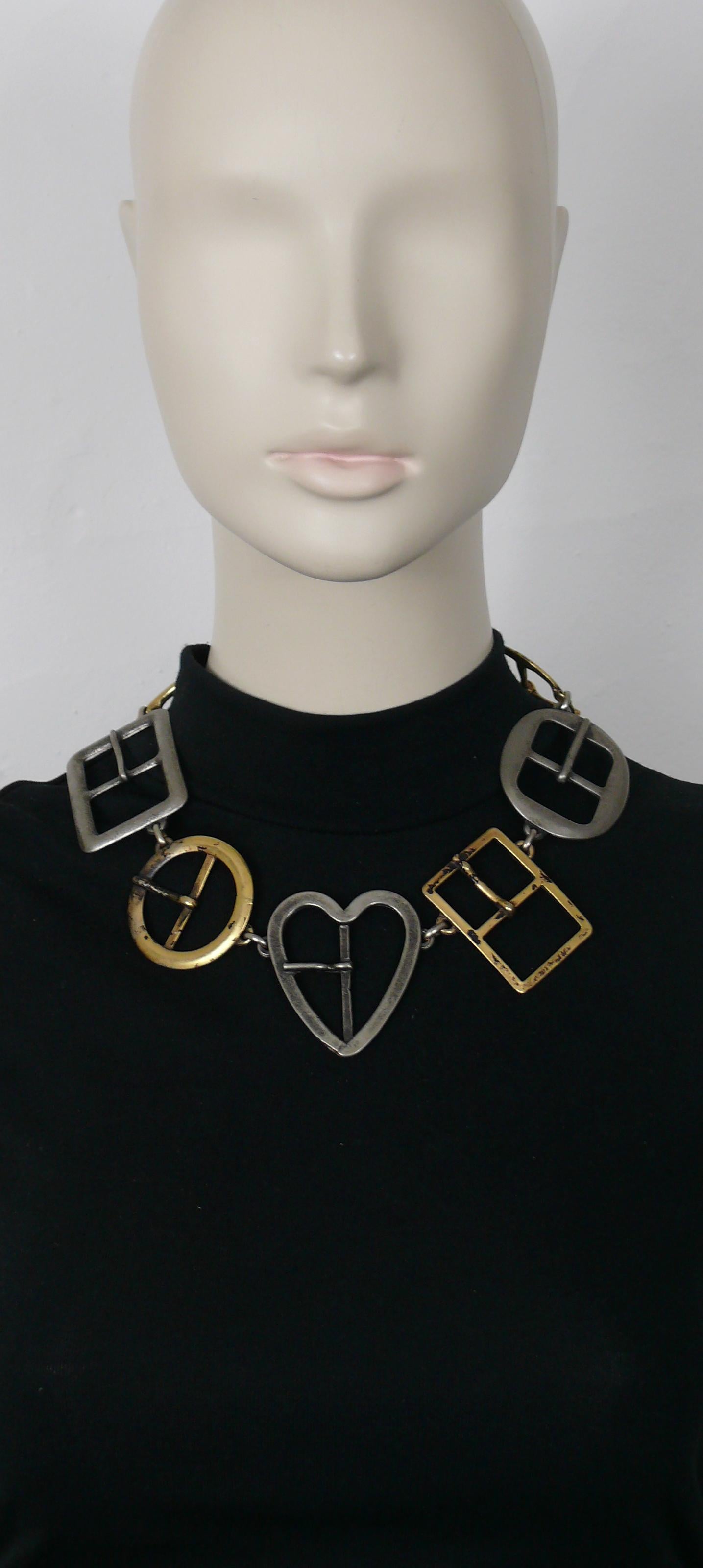 MOSCHINO vintage necklace featuring buckle links.

Silver tone and gold tone hardware.
Antiqued patina.

The antiqued/black patina is from original manufacturing.

T-bar and toggle closure.

Embossed MOSCHINO.

Indicative measurement : length