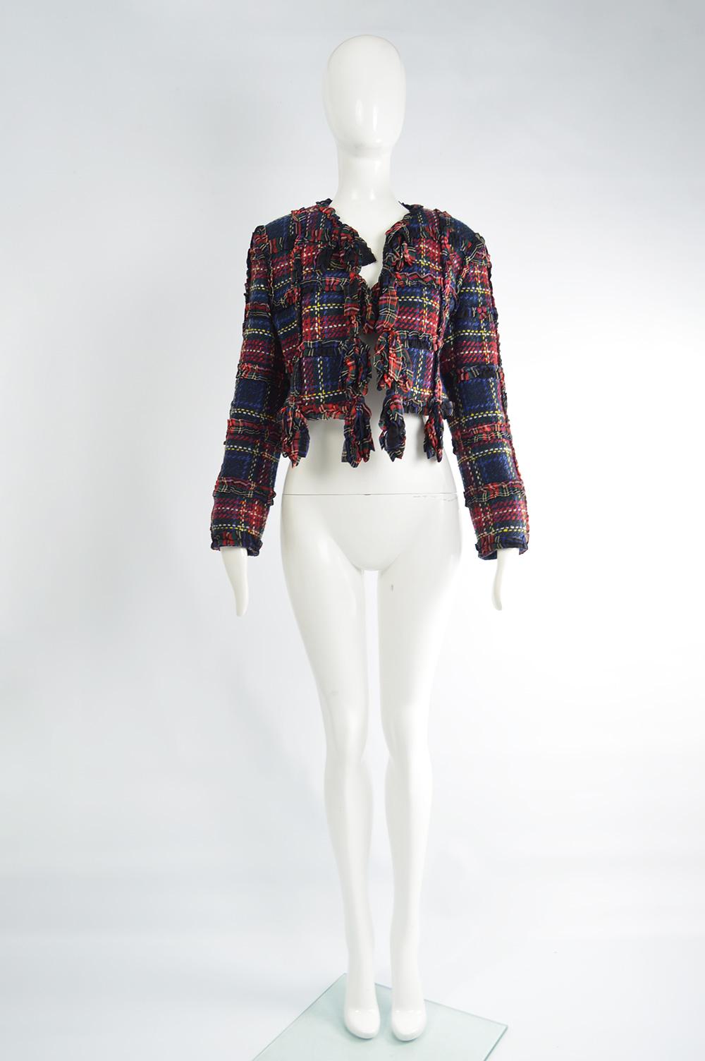 A fabulous vintage Moschino jacket from the autumn winter 1993 collection. In a red, blue and green tartan plaid checked wool with a boxy shape and ruffled ribbons.

Size: Marked I 42 but fits more like a modern UK 8-10/ US 4-6/ EU 36-38. Please