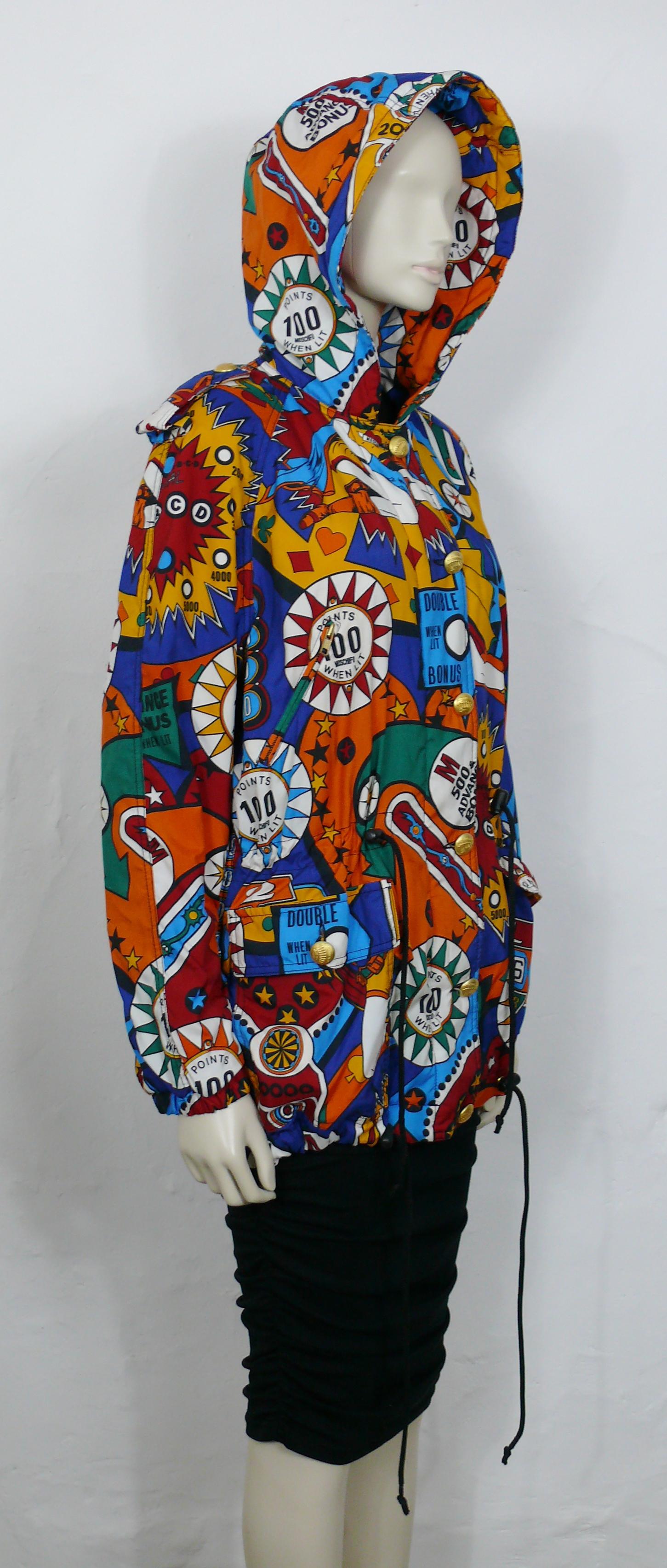 MOSCHINO vintage hooded jacket featuring an opulent multicolored super hero pinball iconic print.

This jacket features :
- Opulent multicolored super hero pinball iconin print.
- Hood.
- Front zippered and button down closure.
- 2 front side