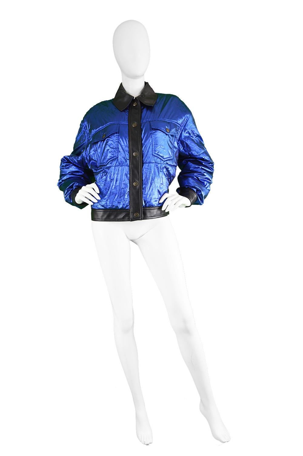 Moschino Vintage Metallic Blue Lamé Women's Bomber Puffer Jacket , 1990s

Size: Marked IT 42/ GB 12/ US 8 but best fits a modern women's Small to Medium with an intentionally oversized fit. Please check measurements. 
Chest - 46” / 117cm 
Waist -