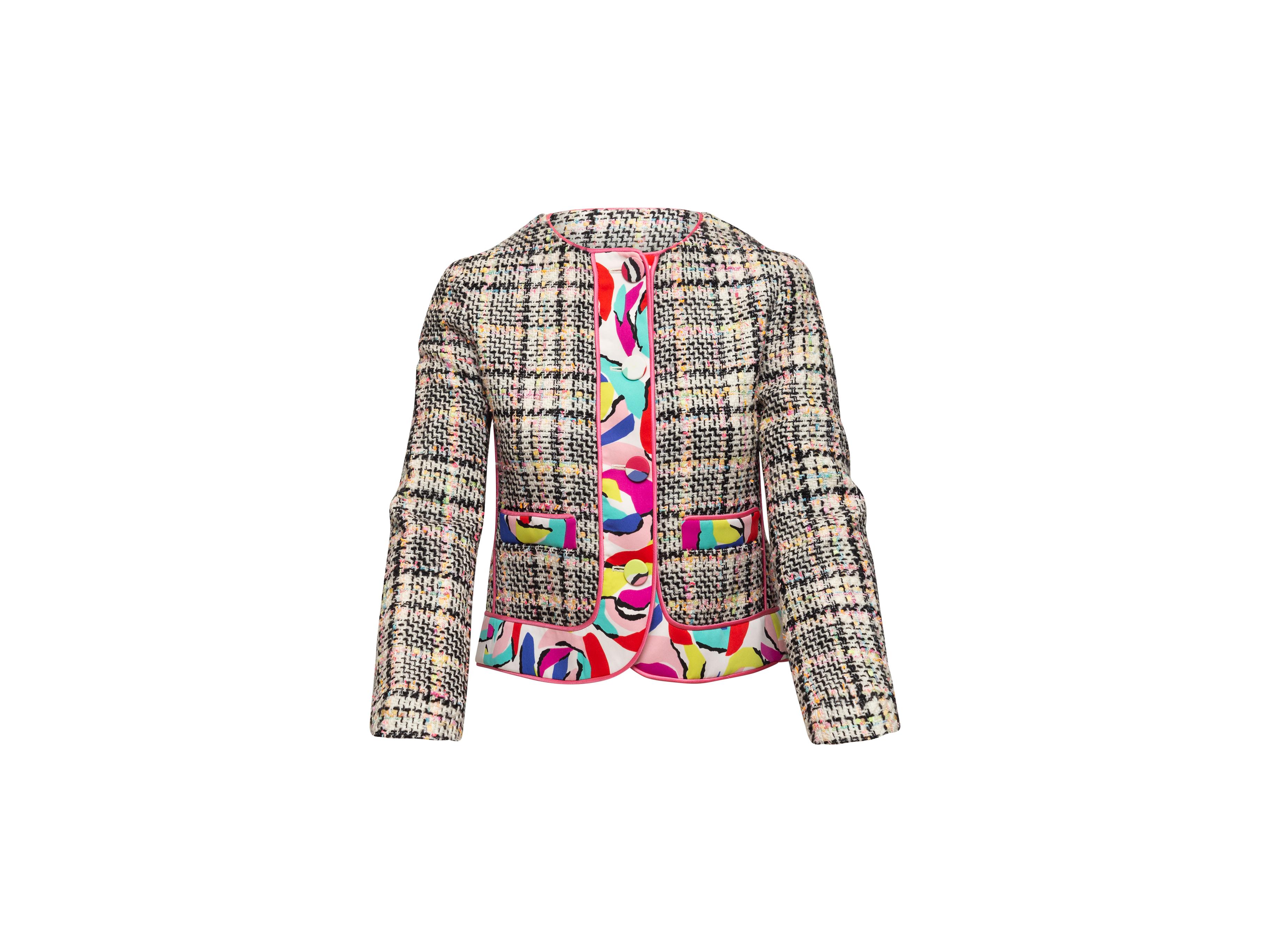Product details: Vintage white and multicolor virgin wool tweed jacket by Boutique Moschino. Multicolor printed trim throughout. Crew neck. Dual hip pockets. Button closures at center front. Designer size 36. 33