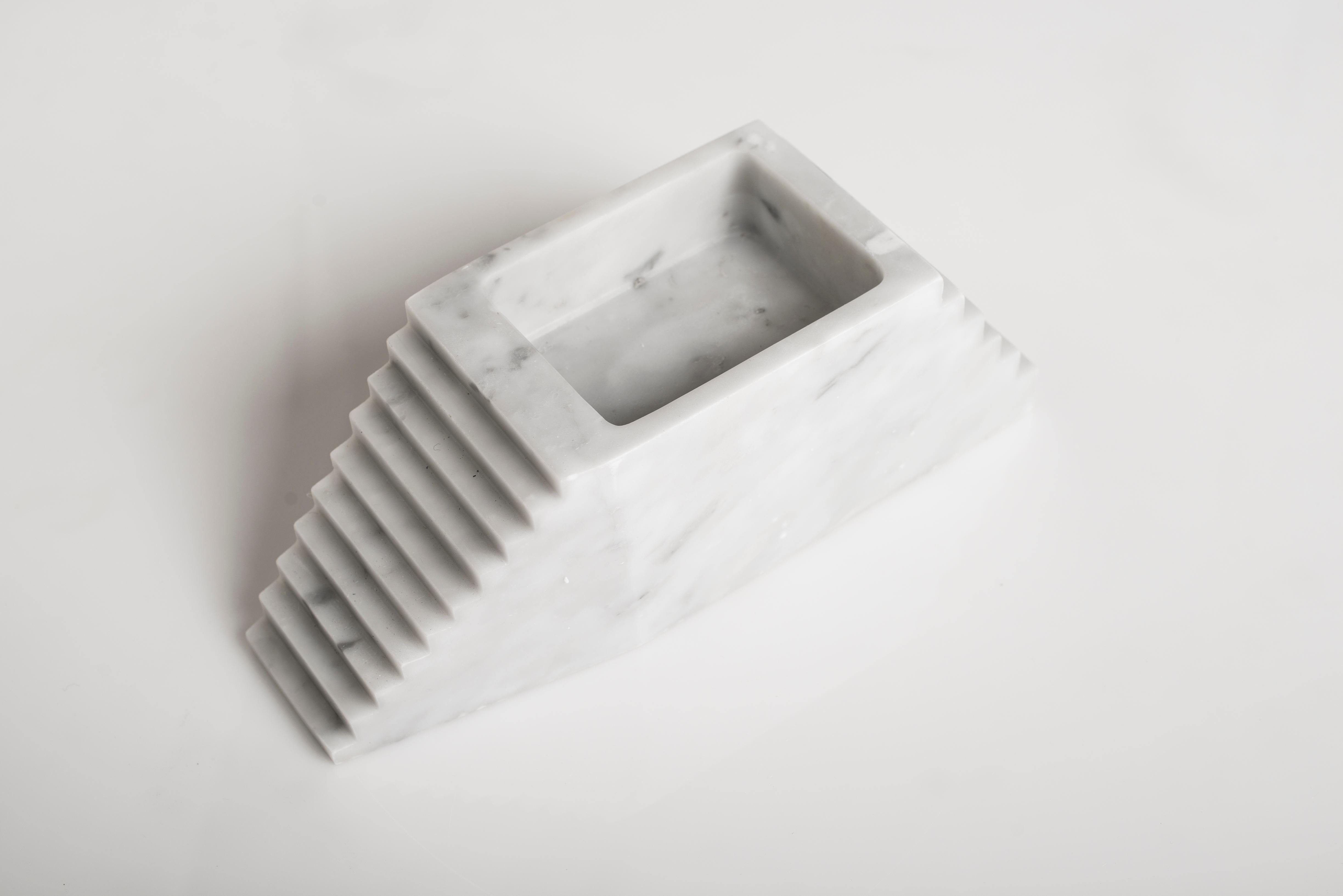 Moscow sculpture by Carlo Massoud.
Handmade. 
Dimensions: D 10 x W 30 x H 10 cm. 
Materials: Carrara Marble.

Carlo Massoud’s work stems from his relentless questioning of social, political, cultural, and environmental norms. He often pushes