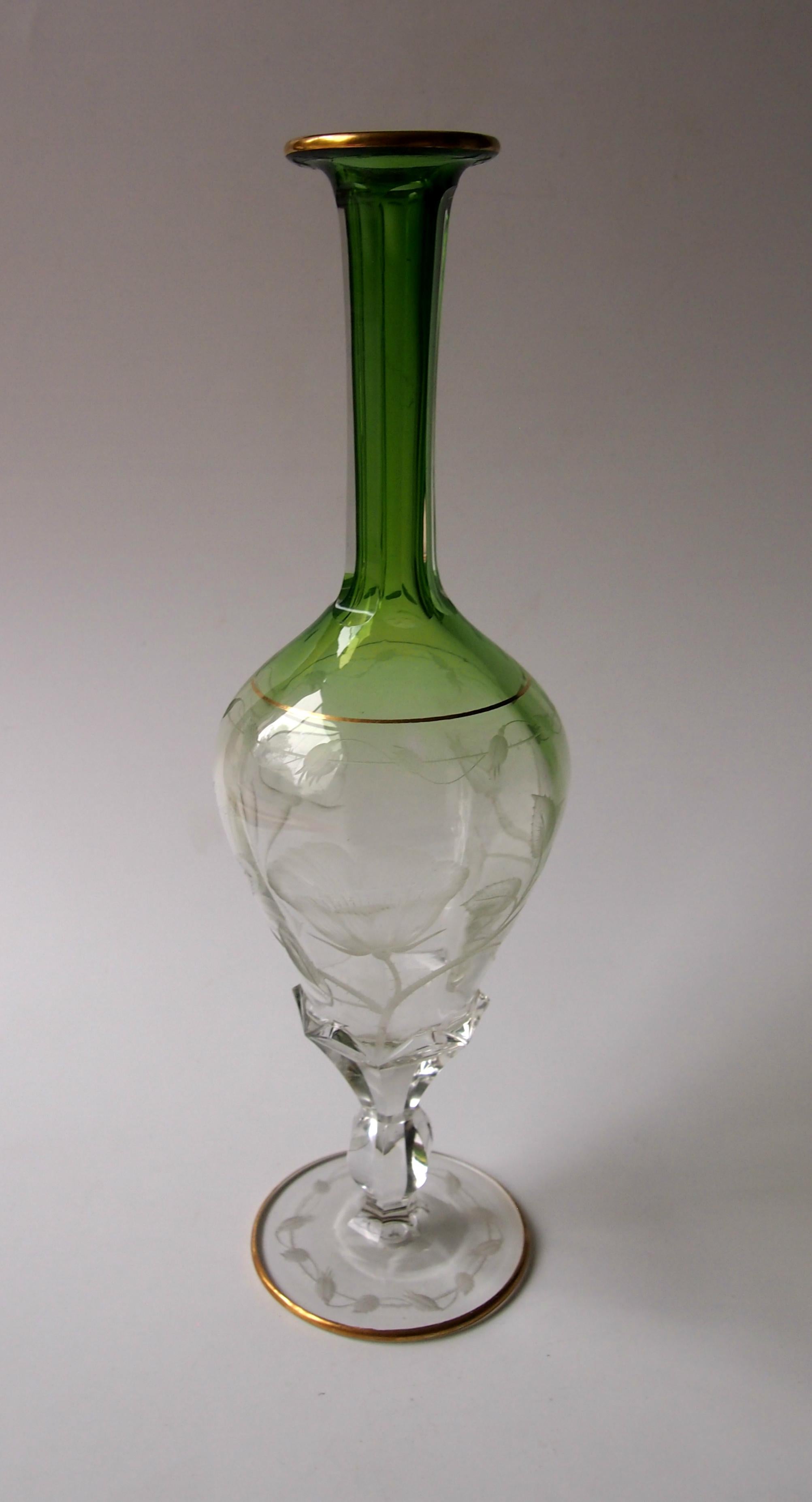 A magnificent Art Nouveau large green to clear, hand-cut and gilded decanter and two matching glasses by Moser. Part of a suite purchased In August 1912 from the world-famous retail shop - J & L Lobmeyr of Vienna. This glass suite is in the Moser