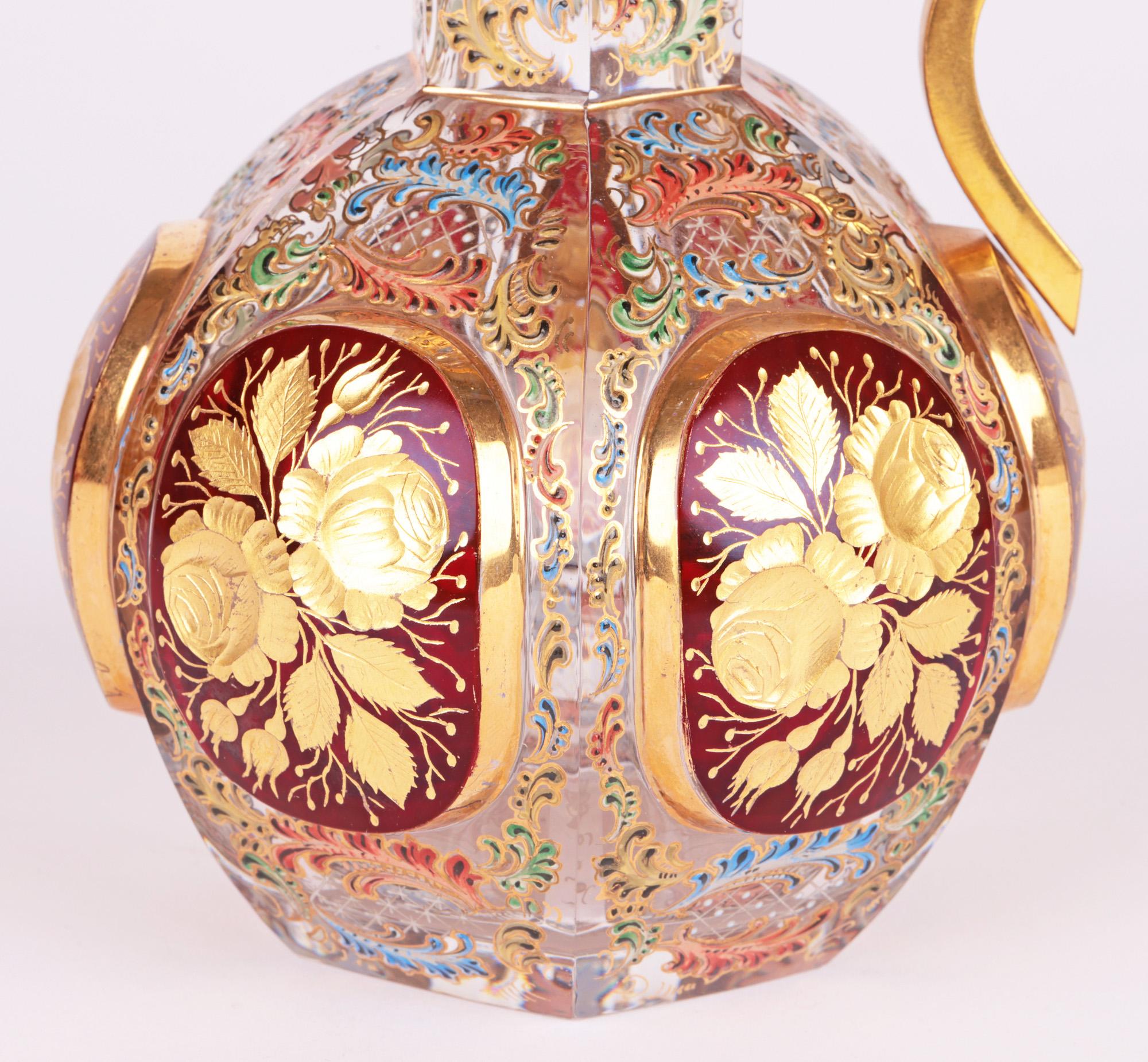An exceptional Moser Biedermeier attributed Bohemian enamelled and cut glass handled ewer with gilded metal mount dating from the 19th century. This beautifully made ewer is of hexagonal shape and made in thick clear glass standing on a narrow flat
