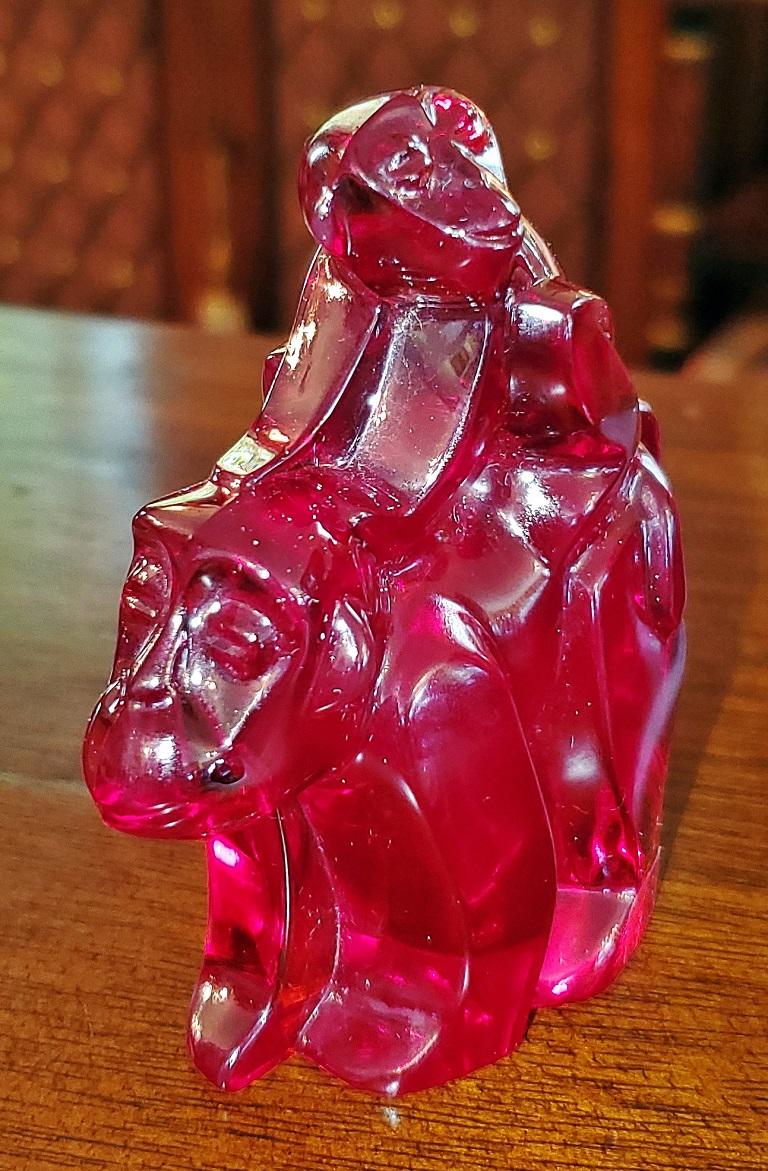 Presenting a lovely vintage Moser Bohemian glass monkeys decoration.

20th century and made by the famous Bohemian glass maker, Moser of the Czech Republic.

It is a ruby red crystal depiction of a small monkey riding on the back of a larger