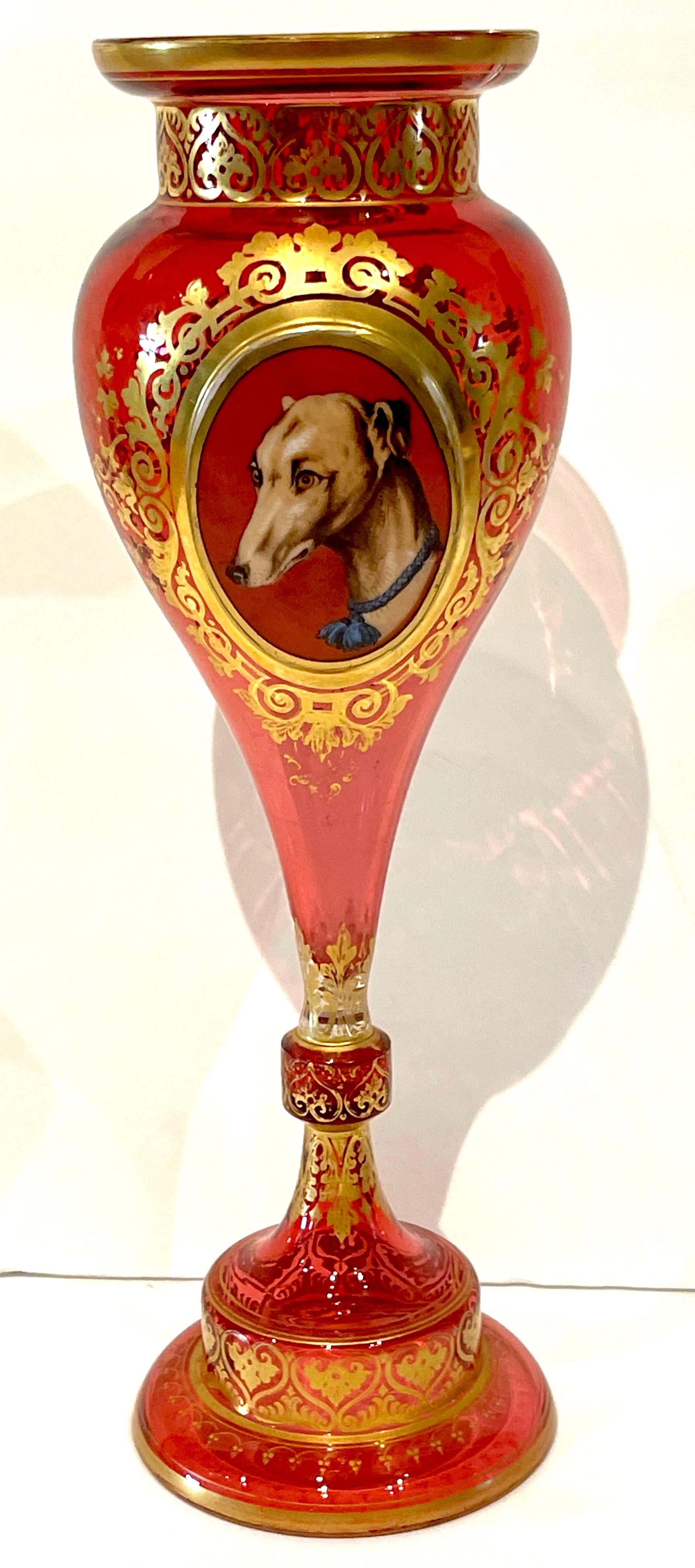 Moser Cranberry, Gilt & Enameled 'Whippet & Goat' portrait vase. 
Czech-Republic, Circa 1880s.
A fine example, a stylized undulating trumpet vase, executed in beautiful cranberry glass, with exquisite gilt enameling. The front of the vase is