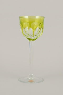 Moser, Czech Republic. Four tall white wine glasses in clear and green glass