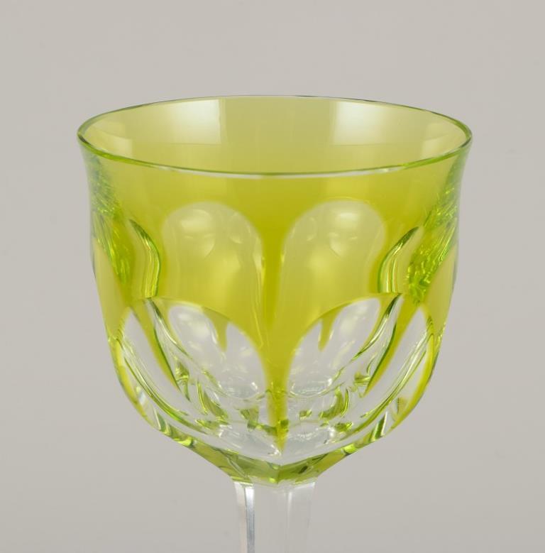 Mid-20th Century Moser, Czech Republic. Six tall white wine glasses in clear and green glass For Sale