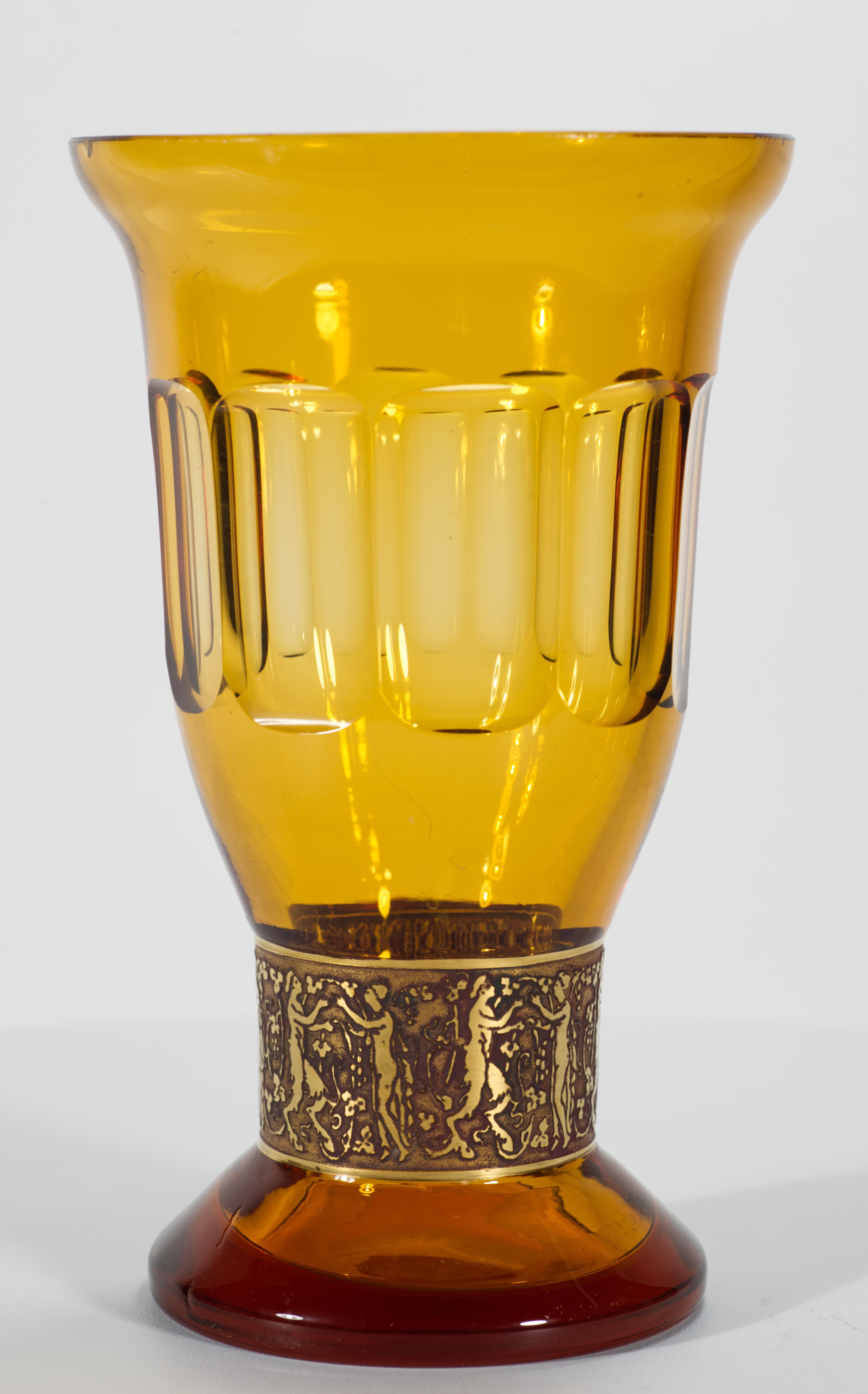  Vintage Bohemian crystal vase from the Fipop series was crafted by Ludwig Moser & Sons Glassworks in Karlsbad, former Czechoslovakia, in 1920s. The vase features faceted cut sides in deep amber-hued topaz glass and a wide band of gold etched