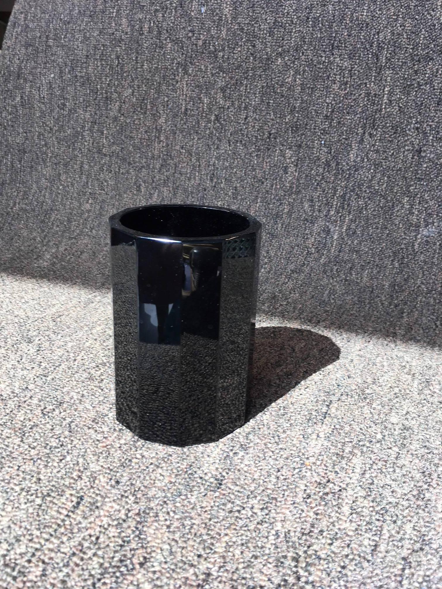 With a captivating pattern inspired by rhythmic geometrical perfection, the Moser for Marc Jacobs black lead crystal table glass features a pure, linear multifaceted pattern, a stylish, functional contemporary work of art for the bar or table. The