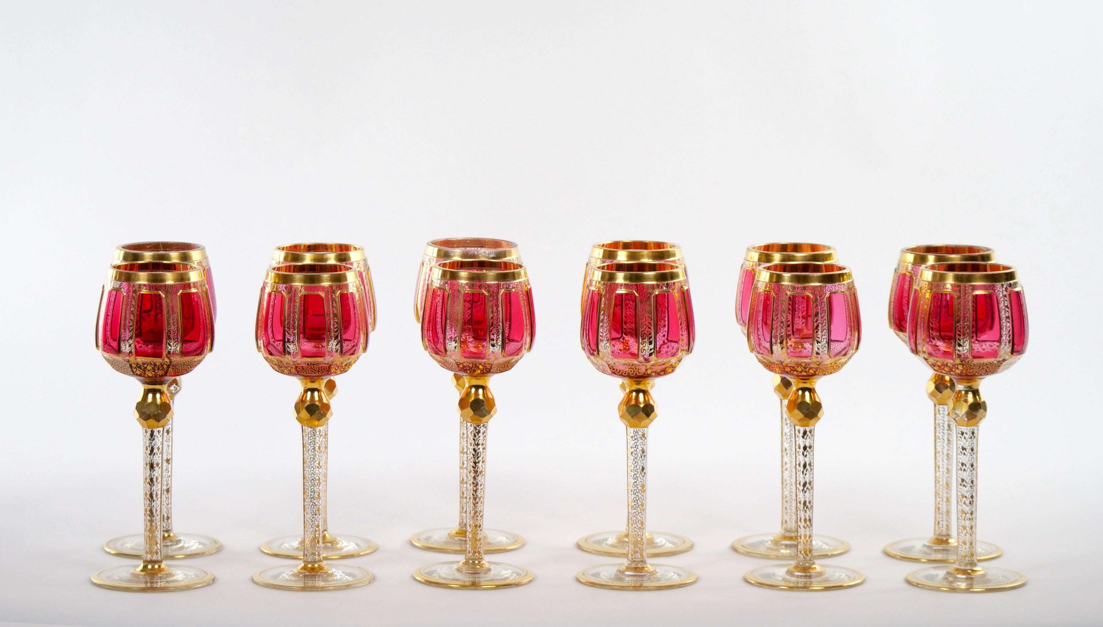 Exquisite Moser cut crystal pink paneled hand decorated design tableware / barware wine goblet service for 12 people. Each glass features a very heavy gilt gold and enameled pink paneled with heavy gilt gold trim top standing on a long yet very