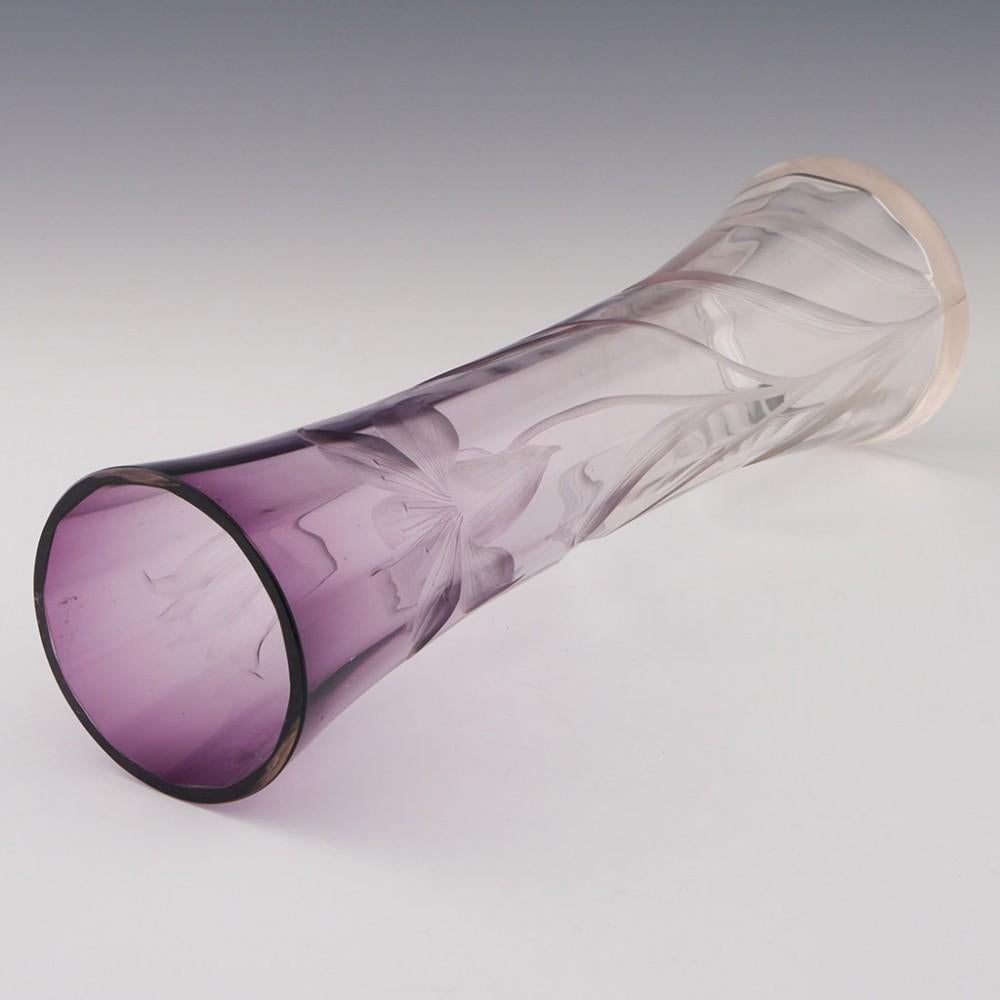 Heading : Moser intaglio cut amethyst vase
Date : c1902
Origin : Karslbad, Bohemia
Bowl Features : Amethyst graduated to clear glass with intaglio cut lillies and rib moulding
Type : Lead free
Size : 30cm height, 8.5cm diameter
Condition :Excellent,