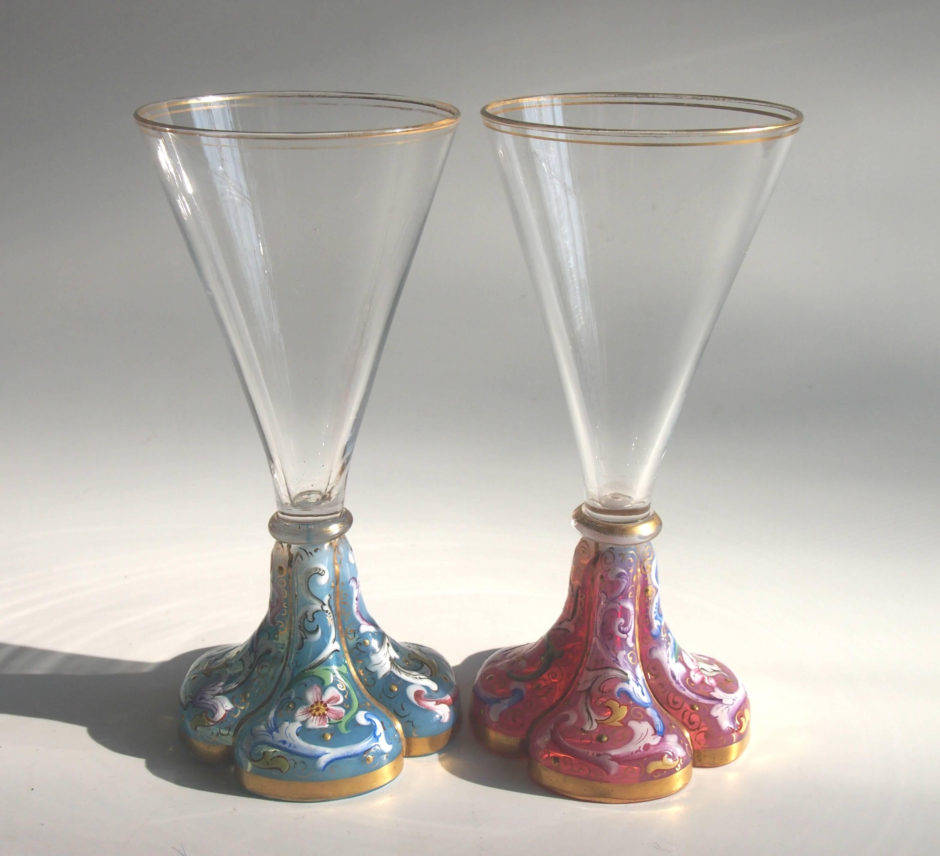 Rare pair of Moser, early Art Nouveau, pink and blue opal enamel footed Liquor glasses. One glass has a pink opal foot the other baby blue opal, each is finely enamelled with flowers and acanthus leaves.

Moser was, and still is, one of the