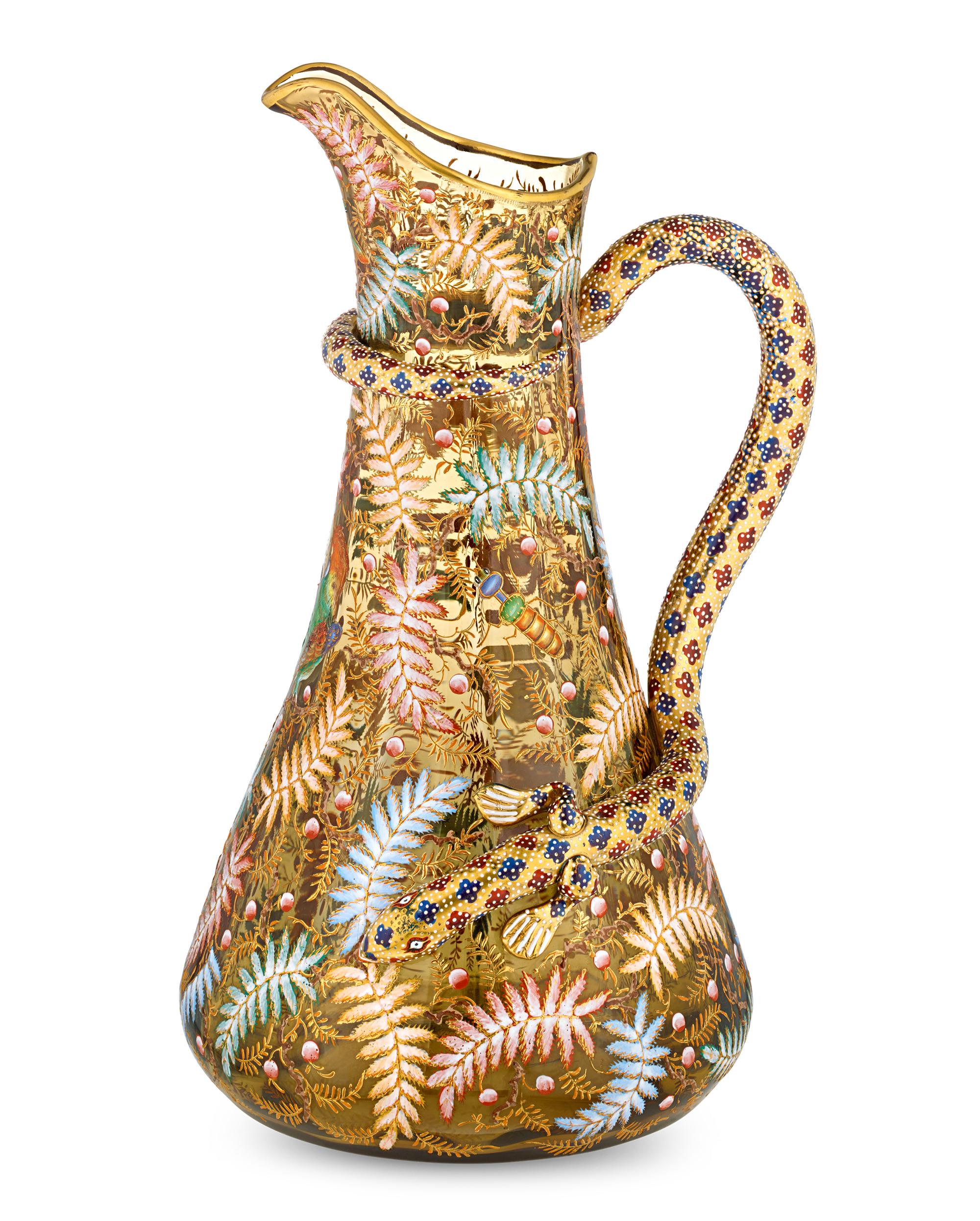 Fantastic wildlife decoration distinguishes this rare Moser glass pitcher. Crafted of luminous amber glass, this pitcher is adorned with the signature Moser gilded fern leaves and berries, including an enameled three-dimensional bee and a colorful