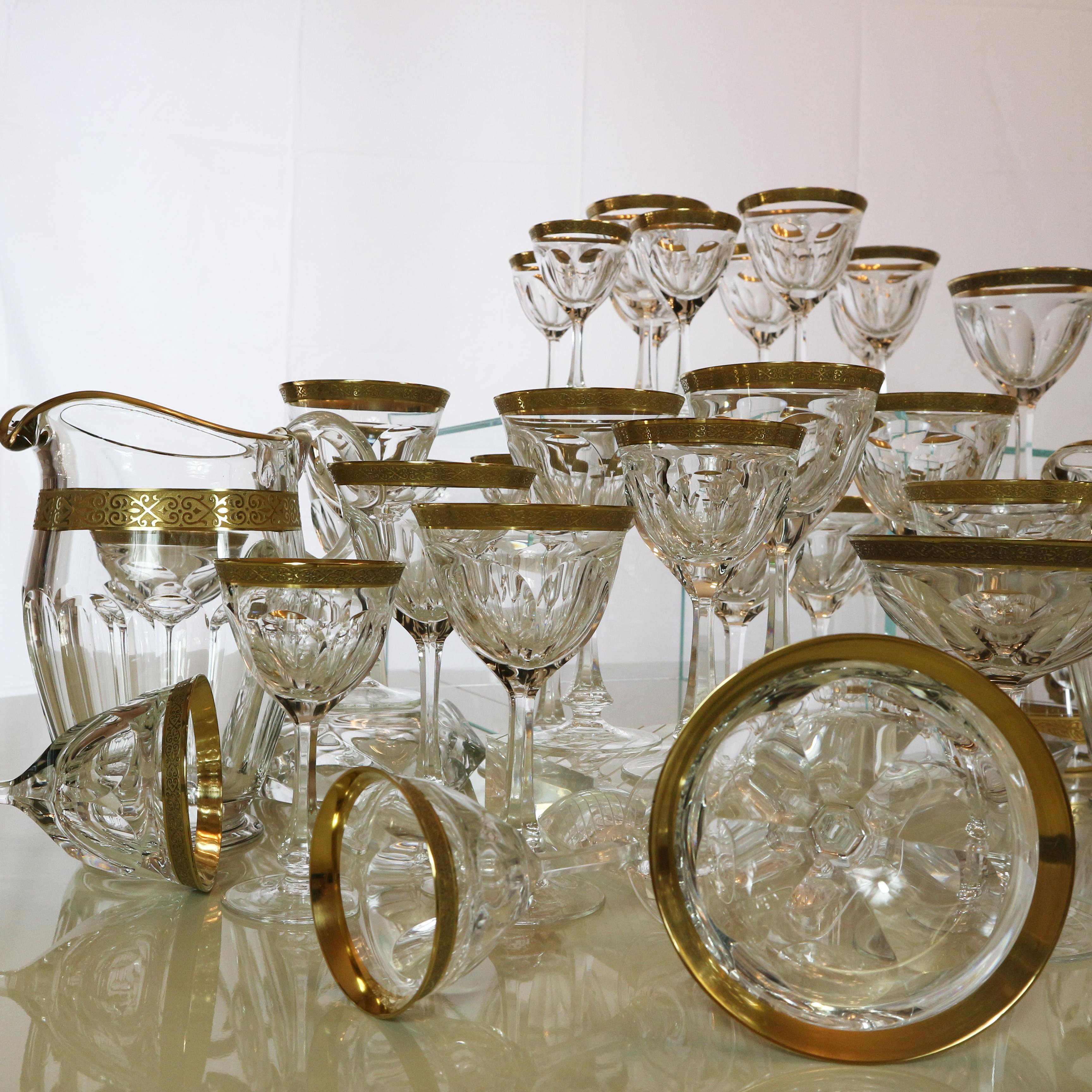 A set composed of 63 pieces Lady Hamilton from Moser glass works.
Featuring ornate handcut details and a thick 24-carat gold. Quality and elegance of the Moser creation.
The service consists of:
-12 water goblets measures: height 17.50 cm,