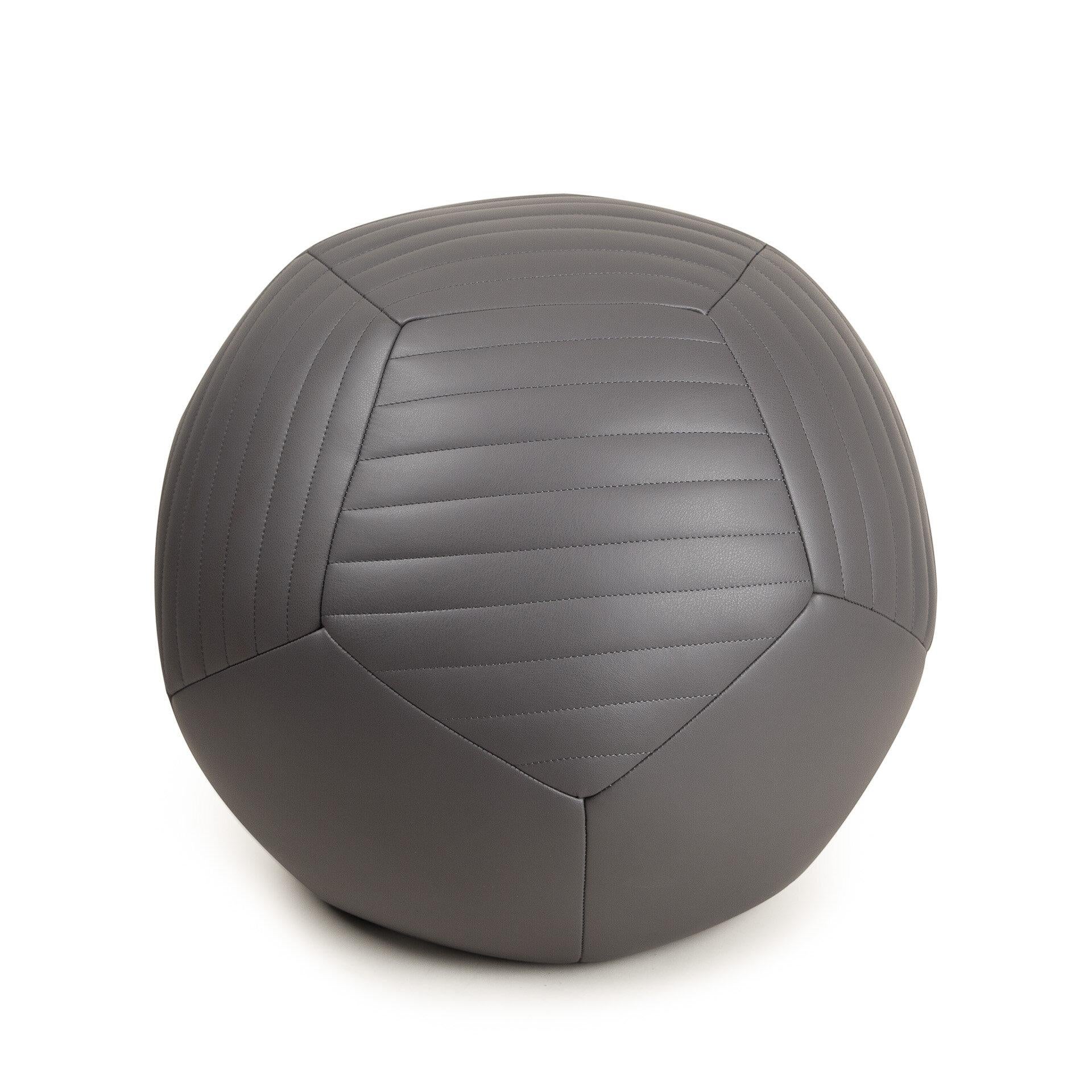 Crafted with supple European leather, the Half-Banded Ottoman by Moses Nadel is designed to add a twist to living room seating and act as a comfortable place to rest your legs or as playful and sculptural decor. Moses Nadel hand cuts each 5-sided