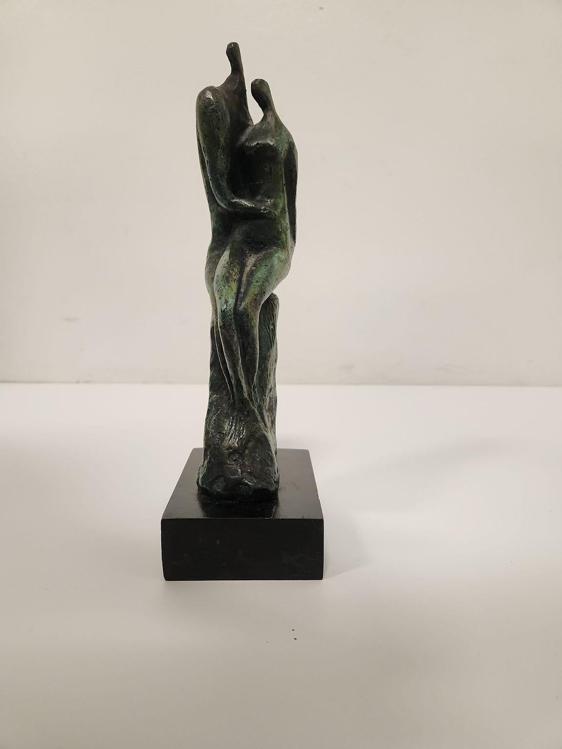 "Pair of Lovers" bronze sculpture on wooden base of male and female seated figures by artist Moshe Sternschuss. Signature Sternschuss and edition number 153/200 inscribed on side of sculpture. 