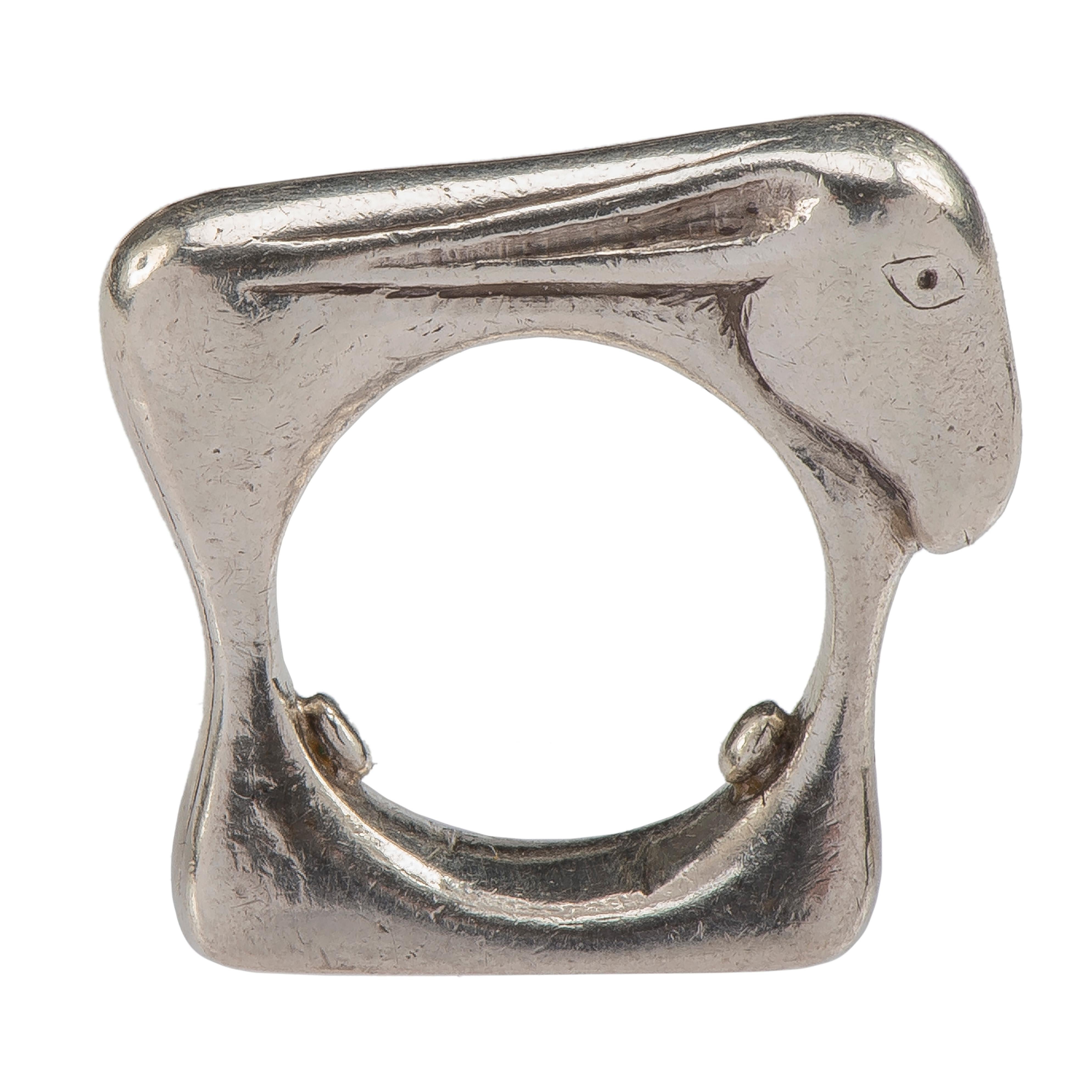 Mosheh Oved Donkey ring
England, c. 1940
Silver
Weight 21.6 gr; Circumference 49.32 mm; US size 5 ; UK size J 1/2 ; At widest point 28.5 mm long

The heavy silver ring is modelled as a donkey in profile view standing on a base with a round opening