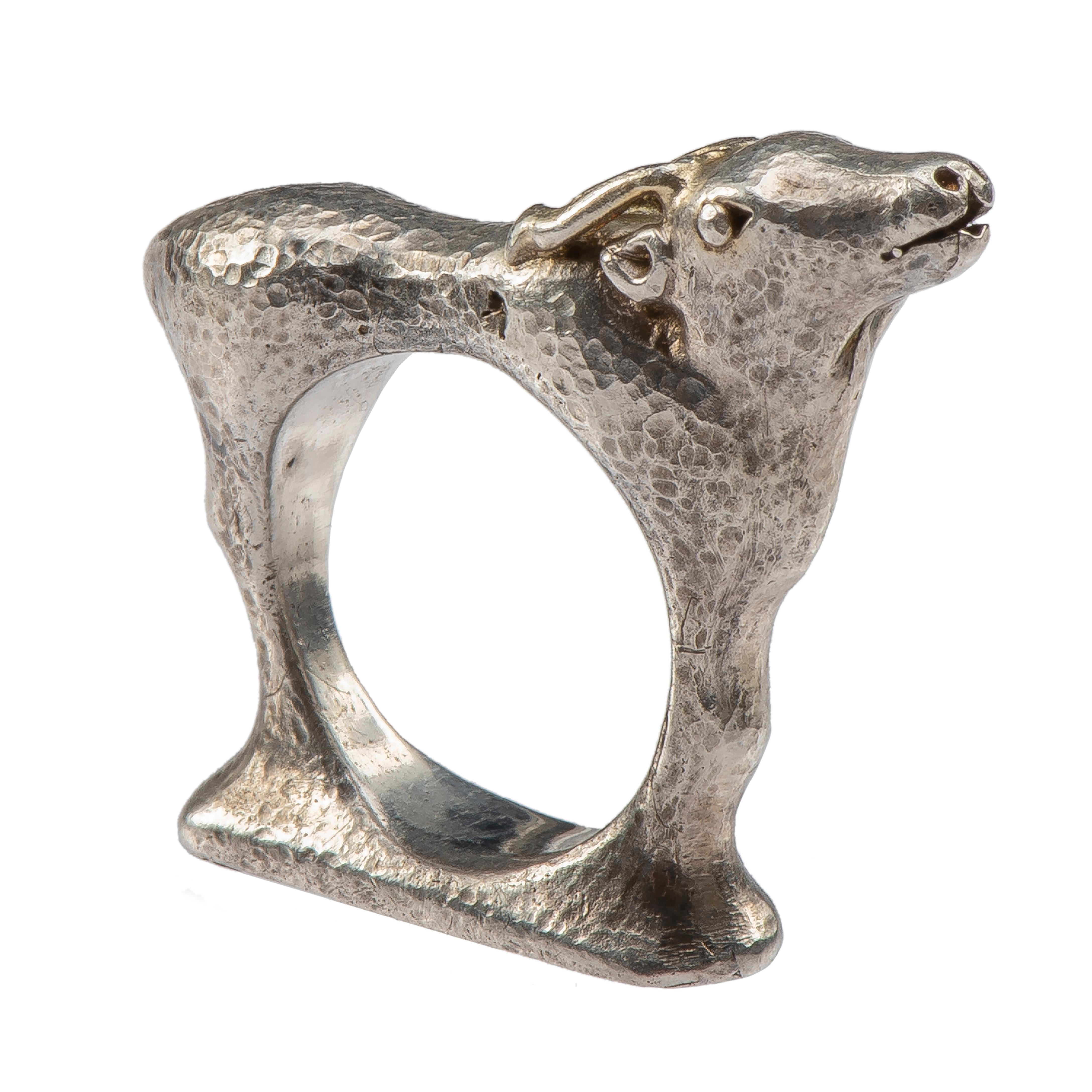 Mosheh Oved Stag ring 
England, c. 1940 
Silver, gold 
Weight 20.4 gr.; Circumference 53.16 mm.; US size 6 1/2; UK size N; At widest point 33.8 mm long 

The heavy silver ring is modelled in the form of a young stag standing on a base with a round