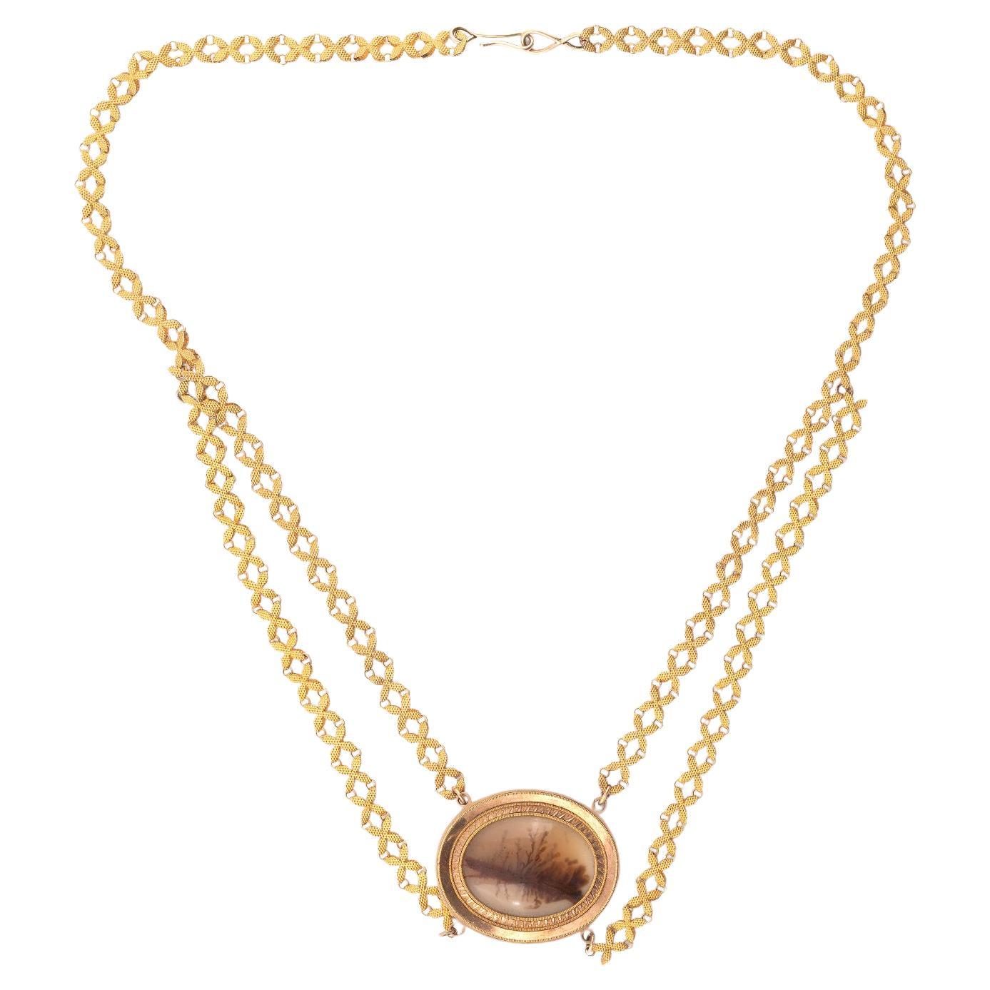 The necklace designed with a oval moss agate plaques within a stamped frame with engine-turned details, joined by double gate-link chains.
Lengths: necklace 51.0cm
Weight: 9,52gr.

Follow on instagram @bernardoantichita