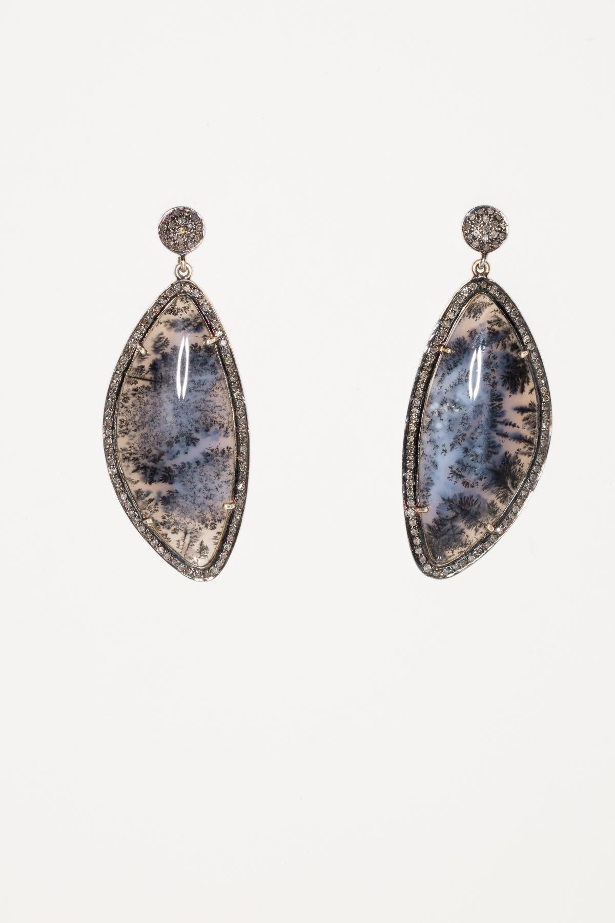 Lovely moss agate set in oxidized sterling silver with pave`-set diamonds around the border and the top of the post.  For pierced ears with 18K gold post.  Weight of diamonds is 1.99 carats and moss agate is 39 carats.