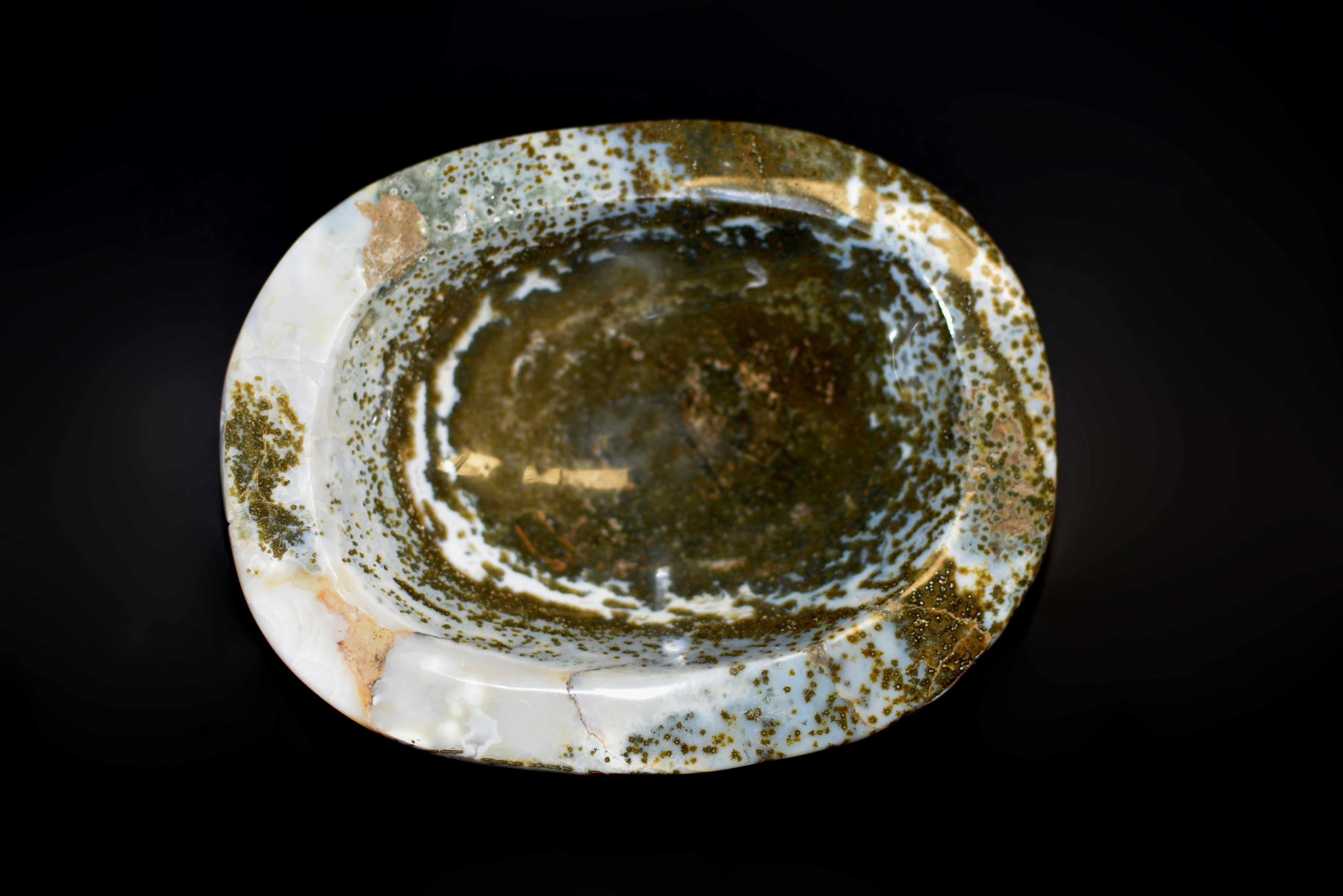 A beautiful large, all natural, moss agate bowl, 4.5 lb in weight, of ovoid form with natural, rounded edge. Spectacular swirls and 
