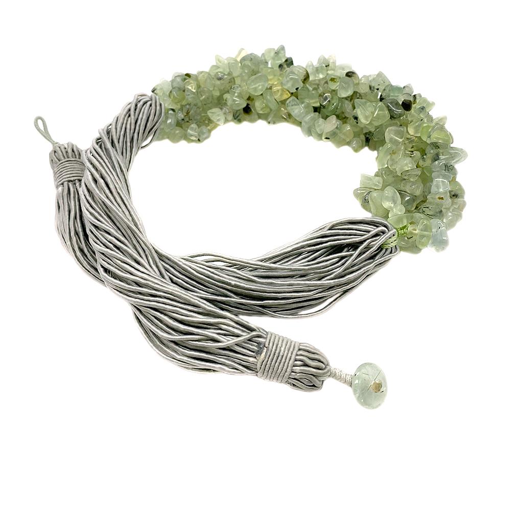 This is a moss agate necklace. It is composed of six twisted strands of moss agate chips and tied on silver gray color silk bundled strands. There is also a moss agate button with silk loop as a clasp for the necklace. This modern multiple strand