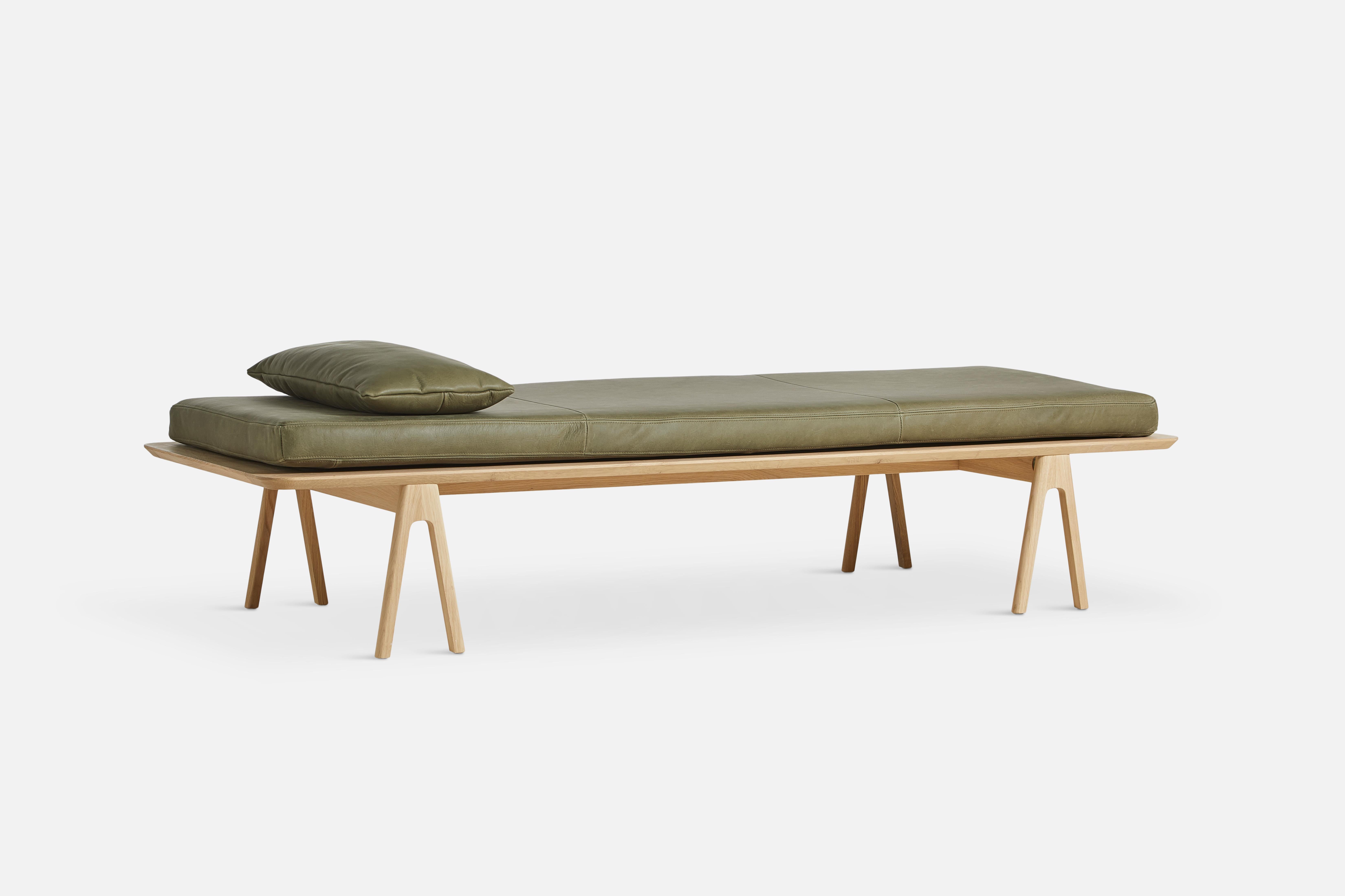 Moss Green Oak Level Daybed by Msds Studio
Materials: Camo Leather, Foam, Oak
Dimensions: D 76.5 x W 190 x H 41 cm // D 23.5 x W 67 x H 8.5 cm

The founders, Mia and Torben Koed, decided to put their 30 years of experience into a new project. It was