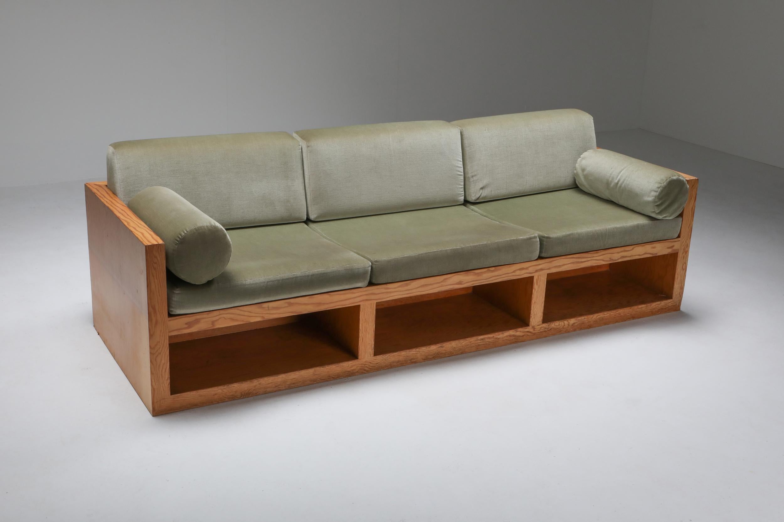 Dutch modernist three-seat couch by an architect from the 1960s
Minimalist and modernist design which incorporates great functionality.
The set holds a very contemporary look through the use of pitch pine and velvet.
The fabric and foam are still
