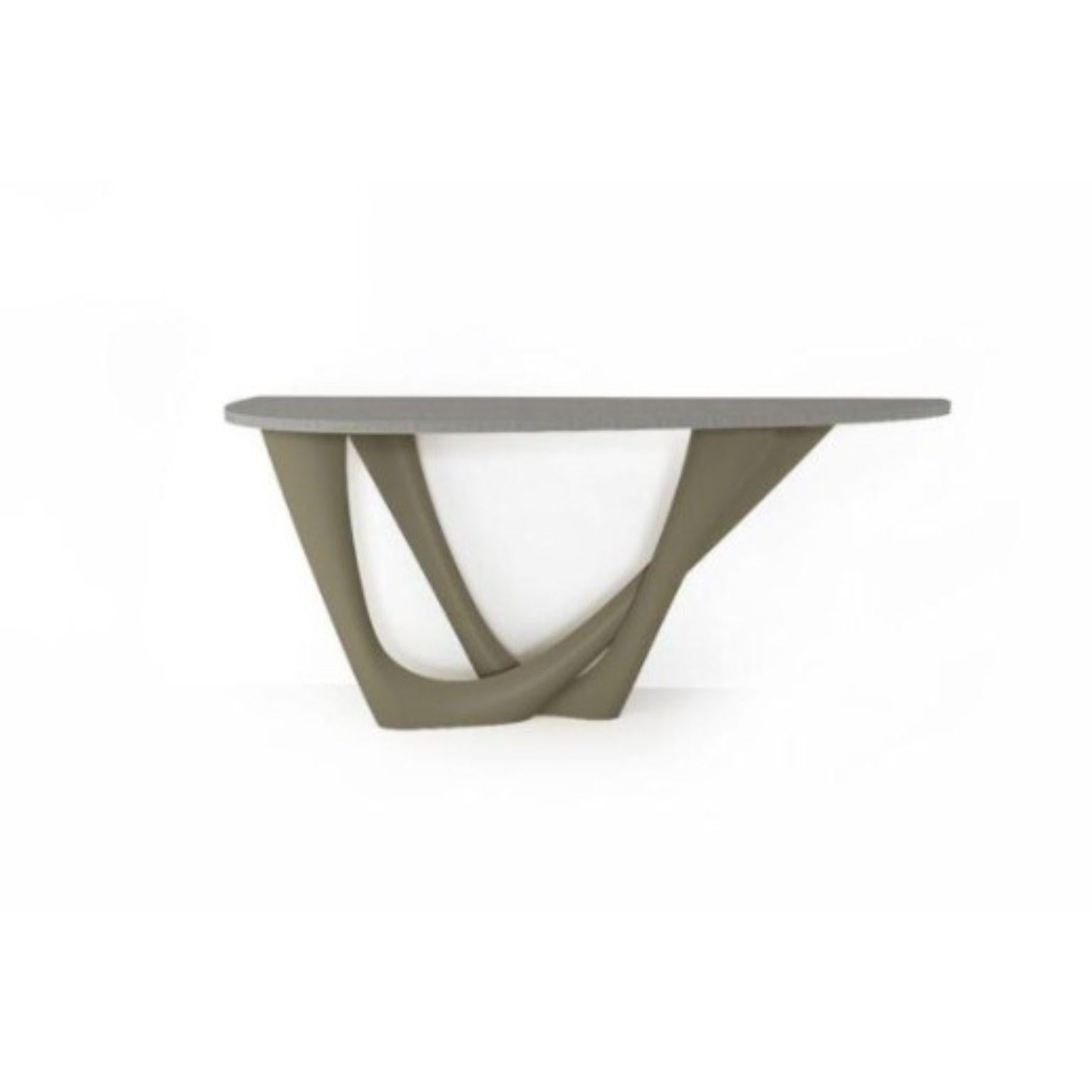 Moss grey G-console duo concrete top and steel base by Zieta
Dimensions: D 56 x W 168 x H 75 cm 
Material: Carbon steel, concrete.
Also available in different colors and dimensions.

G-Console is another bionic object in our collection. Created for