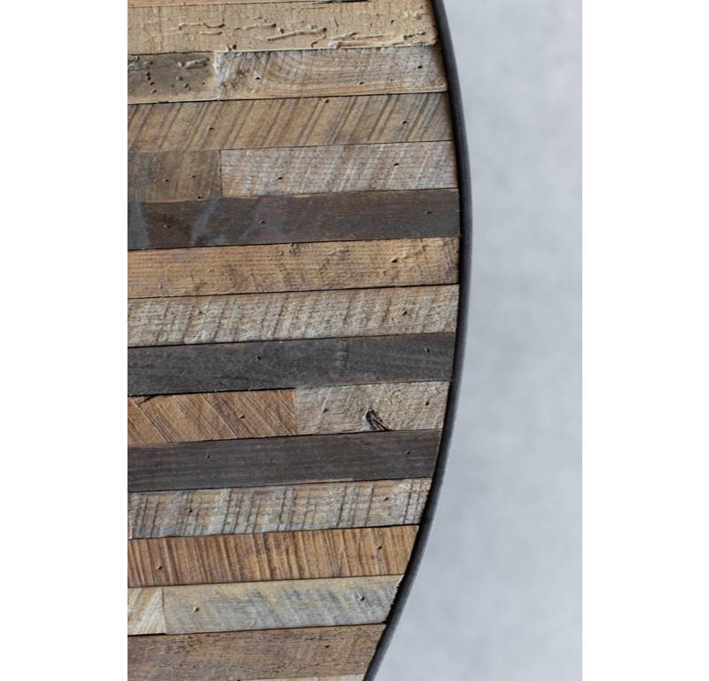The Mossam Coffee Table is an authentically individual piece, crafted from reclaimed hardwood in a patchwork style that showcases the expansive natural variation in the wood. The table top is a canvas of neutral tones, textures, and characteristics