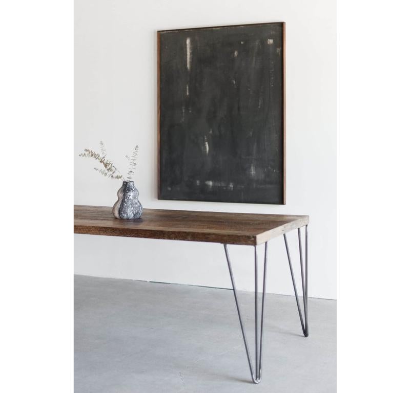 This Dining Table is Custom Made in Los Angeles. Industrial steel legs are cut and welded. Salvaged wood boards are cut to size and attached to plywood substrate.

Reclaimed wood has a wide range of color and texture due to weathering. The wood is