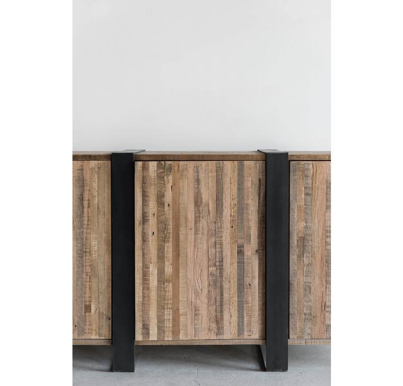 The Mossam Media Cabinet is handmade locally in Los Angeles, California. The cabinet represents a celebration of the variance and unique character that reclaimed wood and other natural, sustainable materials have brought to the design world. The