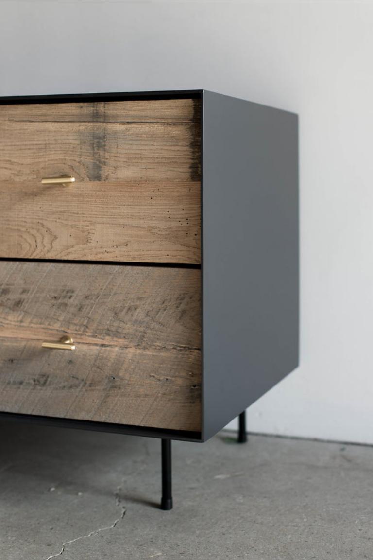 This Nightstand is Custom Made in Los Angeles. Industrial steel casing is sheered to size and attached to a substrate. Wood is cut to size and joined to drawer face. Two drawers with brass pulls and soft close slides. 

Reclaimed wood has a wide