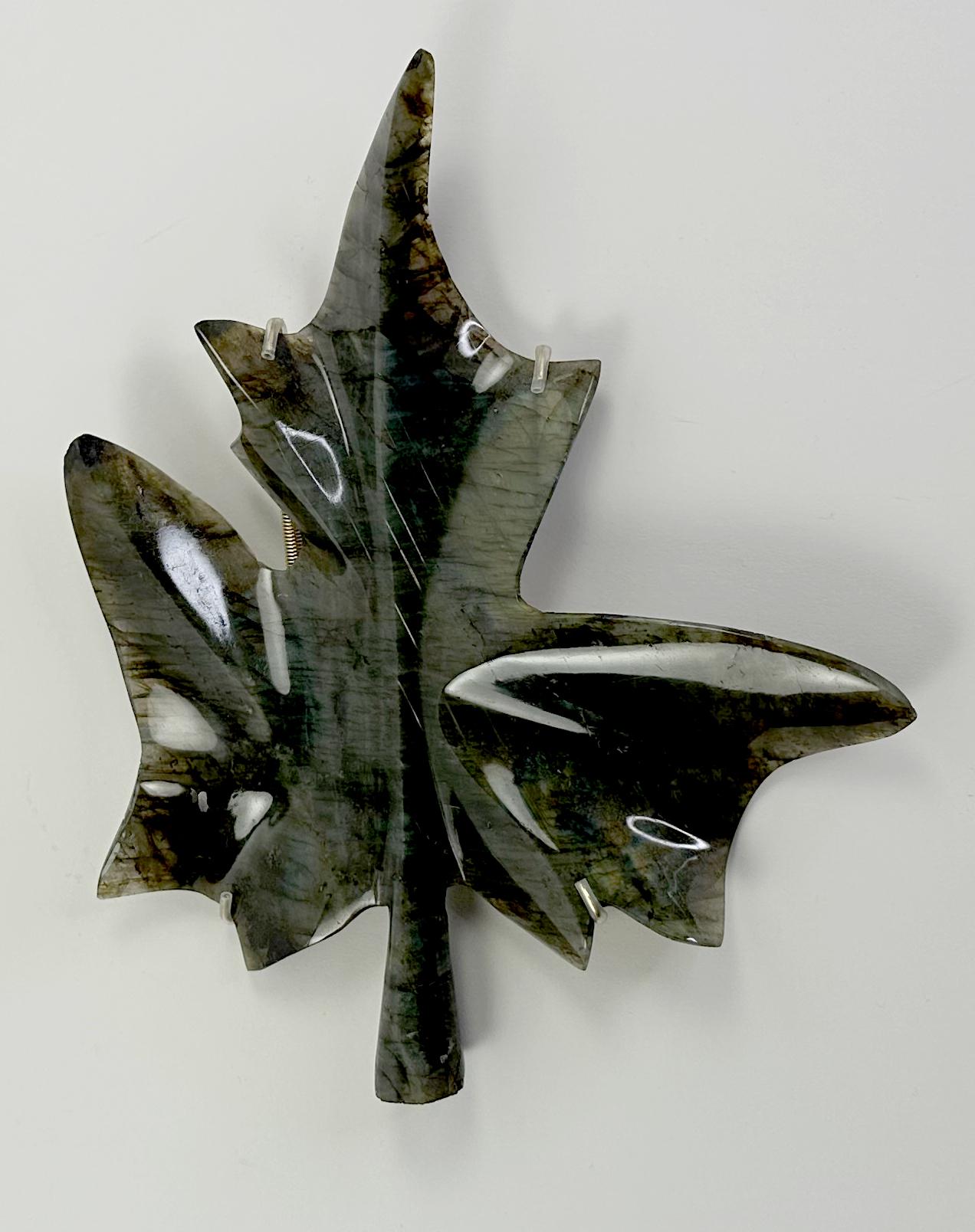 An intriguing custom carved and polished sculptural leaf. Made from labradorite, a mossy forest green color.

In good condition. Some gentle wear and aging consistent with age and use. One piece has a minor chip on the top of the leaf. 

No markings
