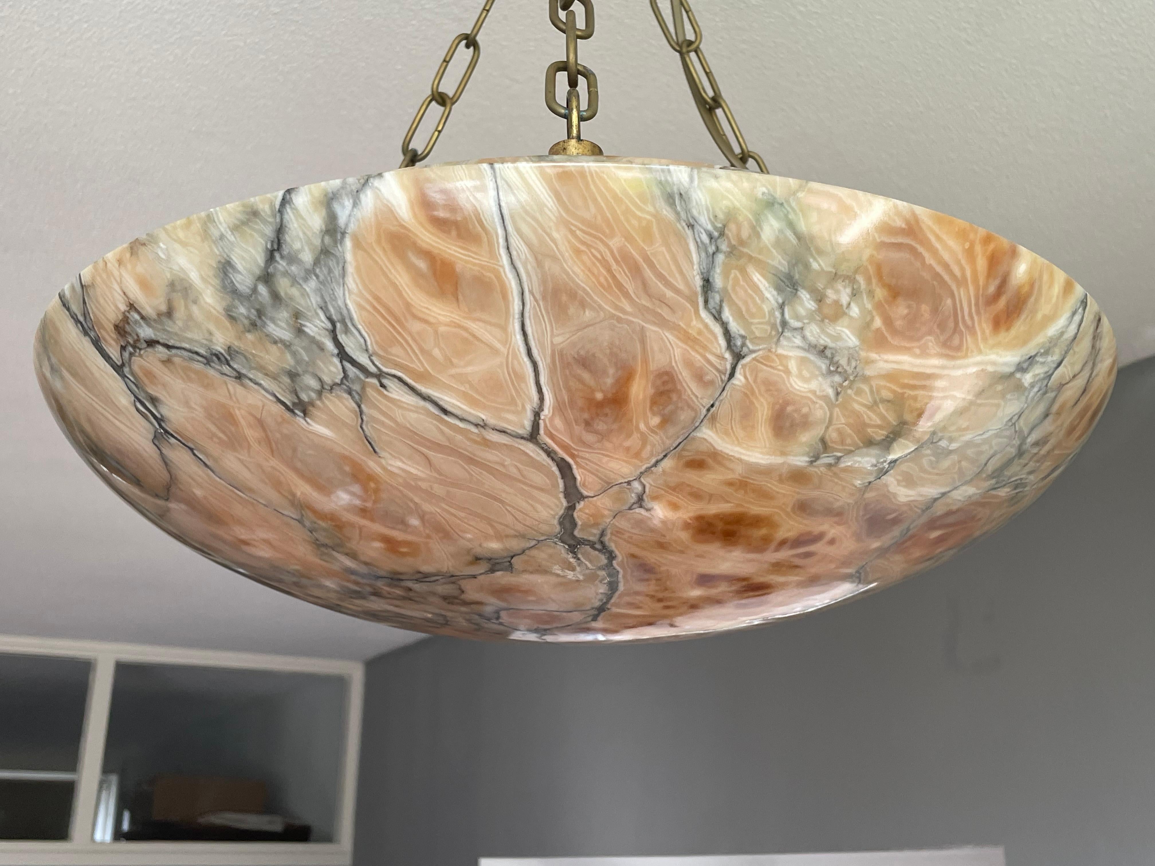 Superb condition, timeless and truly amazing alabaster chandelier.

Thanks to its large size, its excellent condition, its timeless design and the most amazing antique alabaster shade, this three light chandelier is bound to light up someone's days