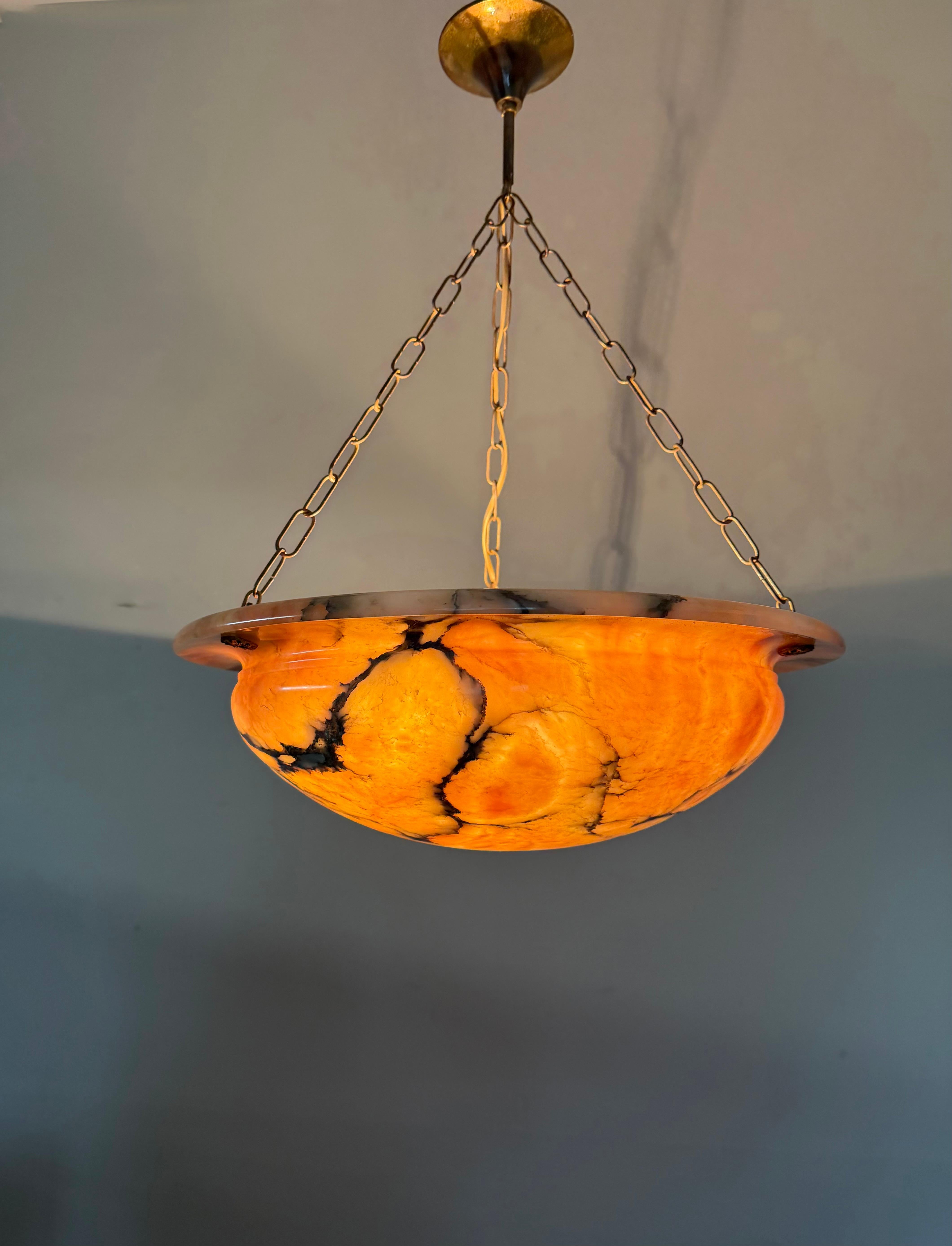 Timeless antique large pendant light with a stunning shape alabaster shade.

Thanks to its timeless design, its large size and its mint condition this three light alabaster fixture will light up both your days and evenings, both in summer and winter