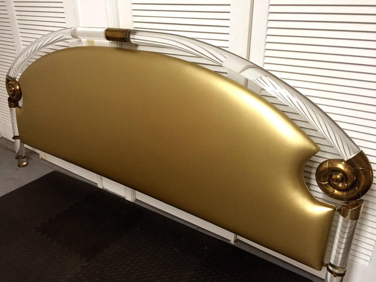 A massive headboard custom-made for the jet setters by Marcello Mioni, circa 1970s. This is one of the most lavish designs in the Hollywood Regency style and it epitomizes the glamorous disco era. The heavy frame was constructed with solid Lucite