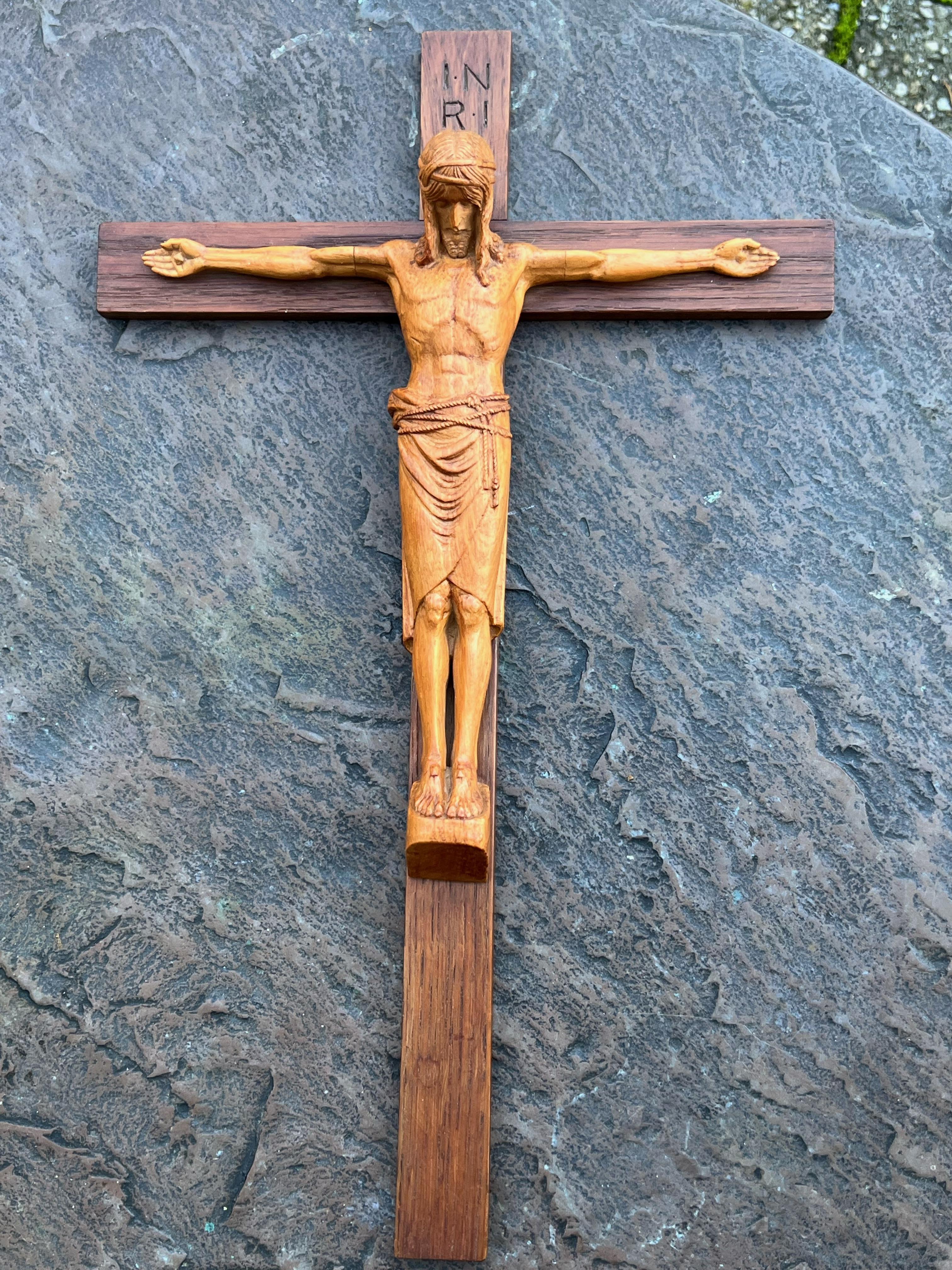 Amazingly wall crucifix with hand carved corpus from Kunstwerkstätten der Abtei Maria Laach.

Over the decades we have sold a number of unique and interesting crucifixes and this here finely carved and stylish specimen is right up there with the