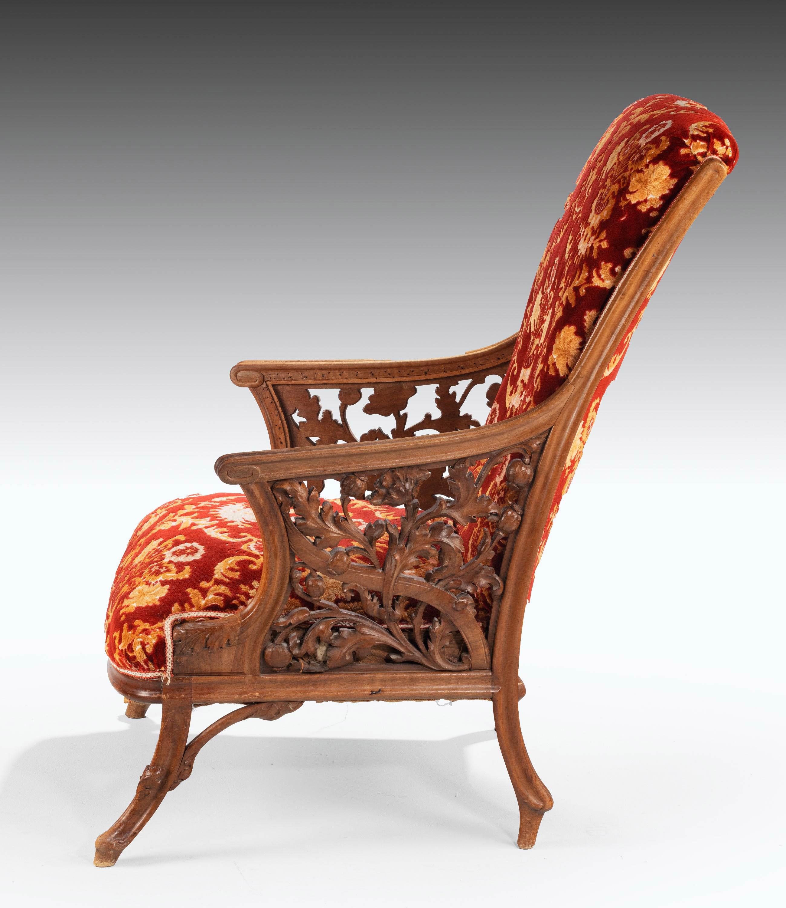 A most unusual and fine pair of 19th century mahogany framed easy chairs. The arm supports over finely carved leaf and floral decoration. Of substantial size and of quite rare form.

Seat height 18 inches.
 