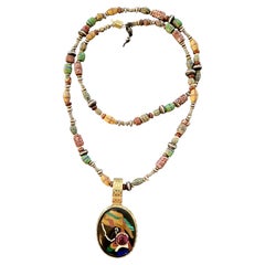 Mother Africa Pendant w/Rare Umbalite ConcaveCut Garnet