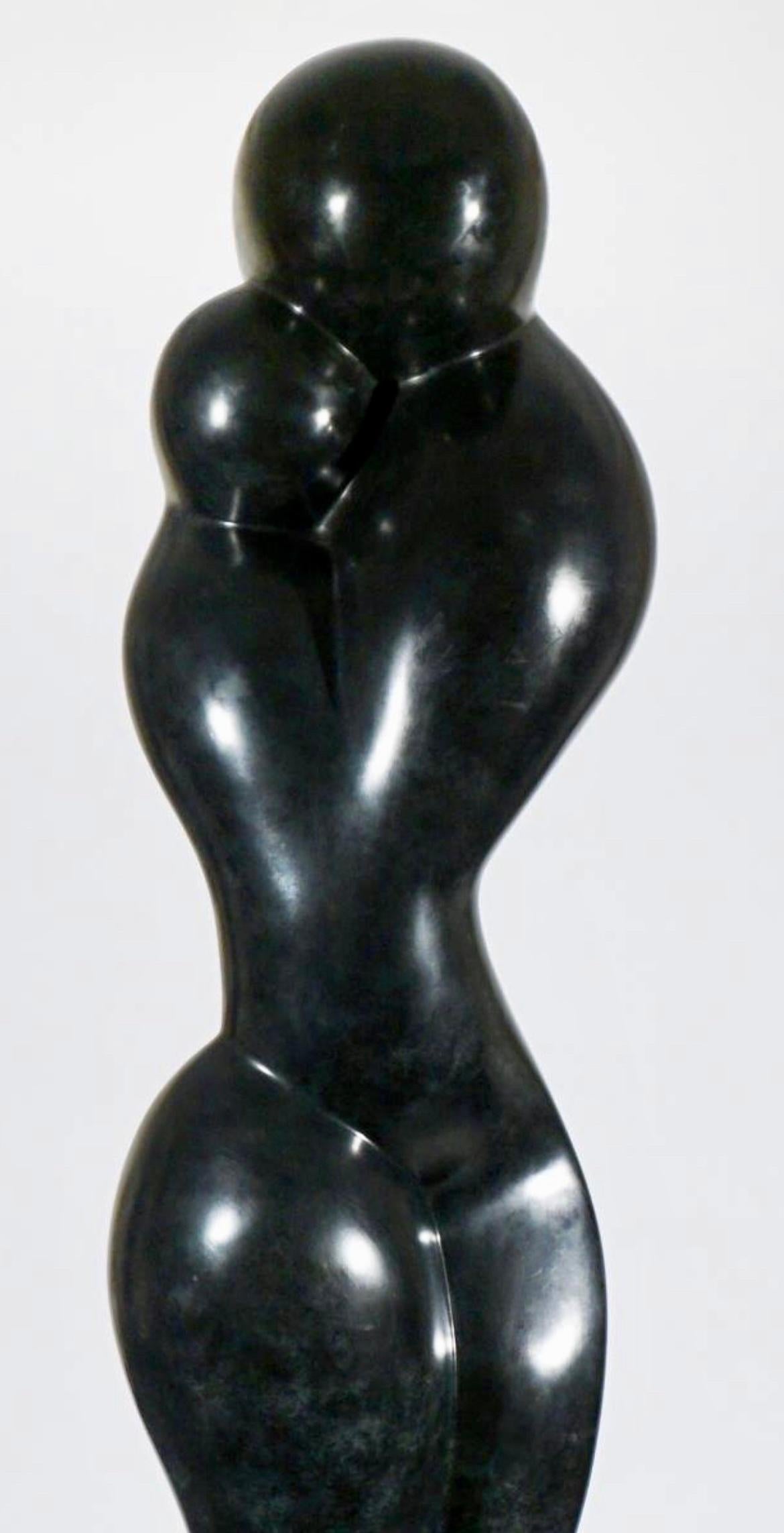 Bronze on polished stone base, signed and edition numbered.  The base was most likely produced by the sculptor to allow the piece to smoothly rotate.  The sculpture stands 80.5