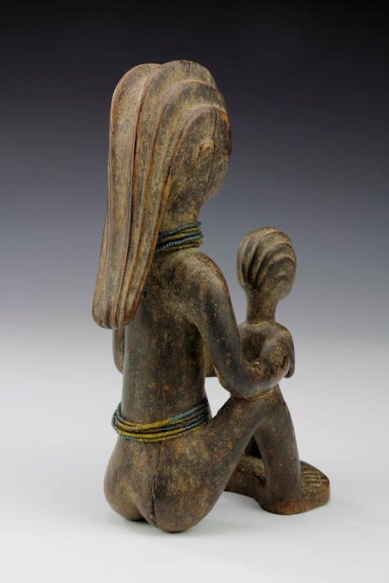 Carved Mother and Child Figure. Kwere, Tanzania For Sale